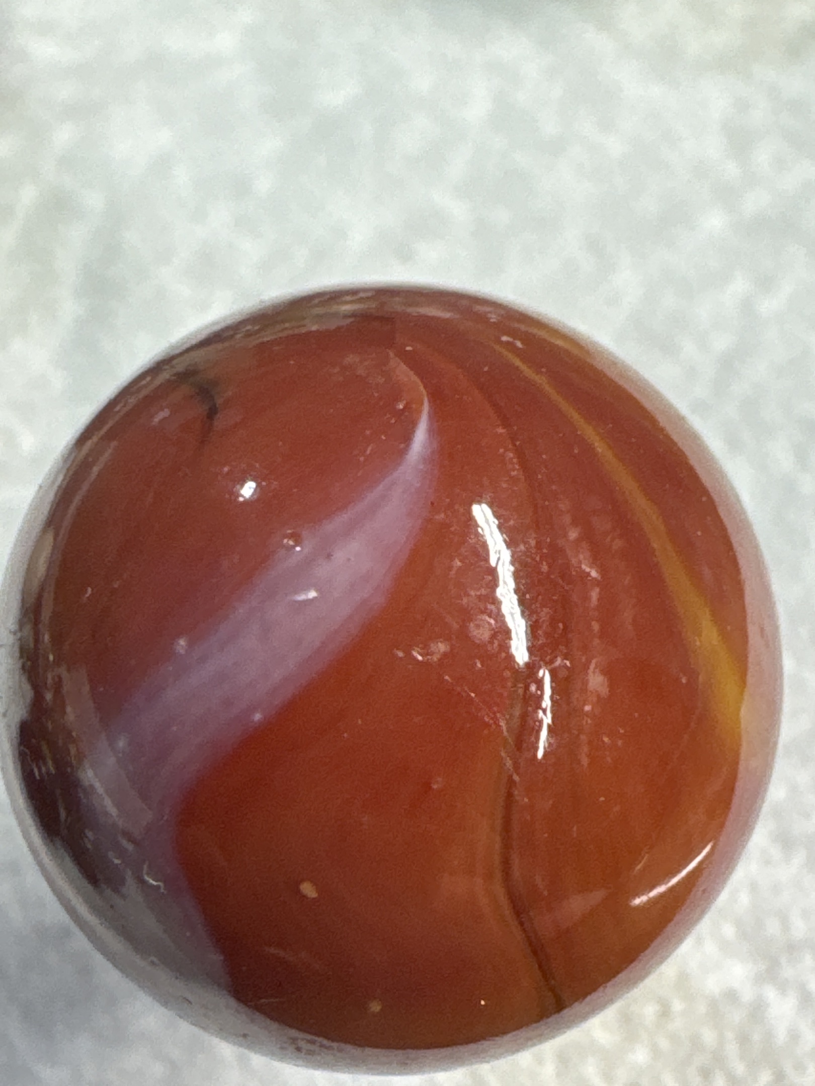 Oxblood Red and White Corkscrew Special by Akro Agate, identification view