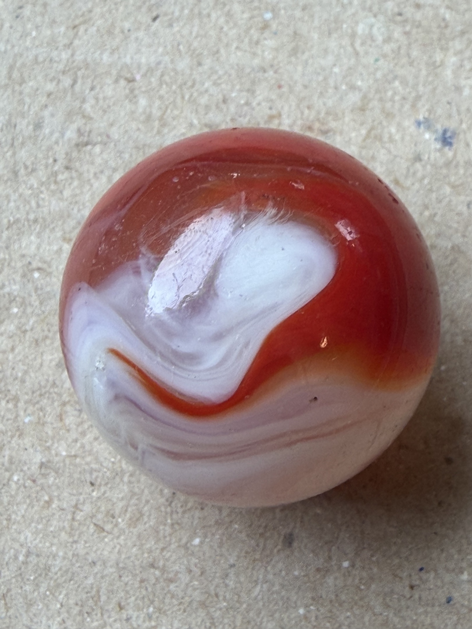 Red and White Swirl (Shooter) by Christensen Agate Company