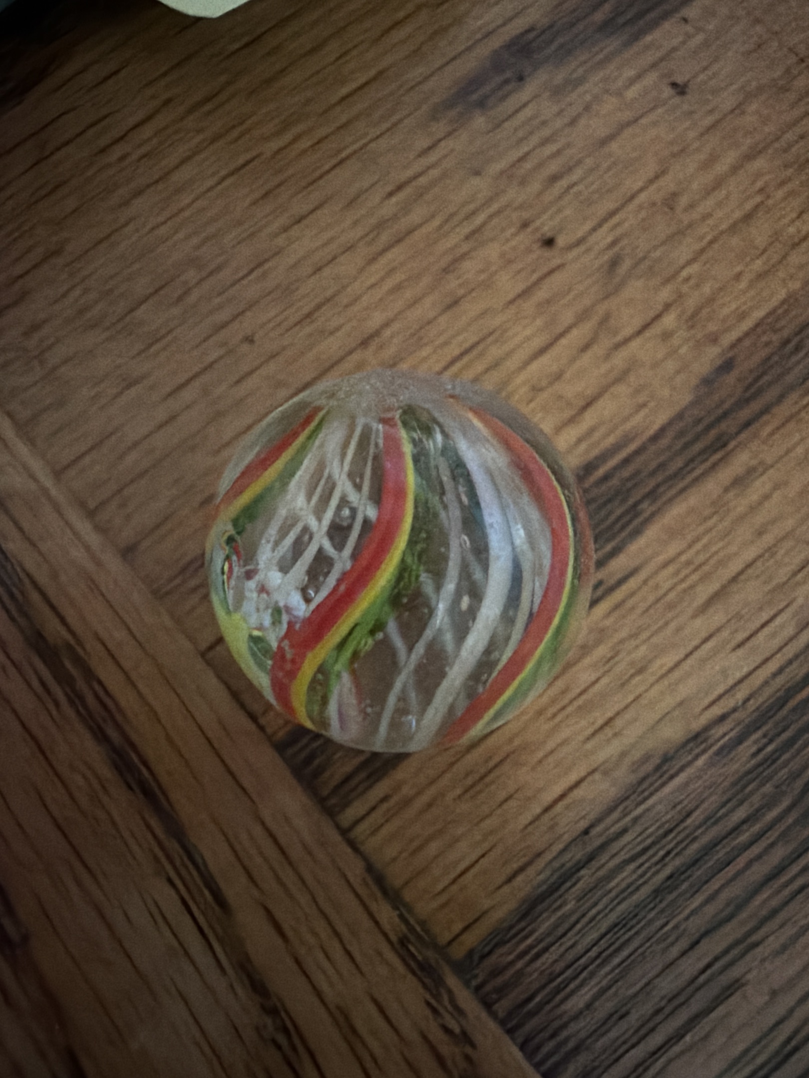 White Latticinio Core with Orange, Yellow, and Green Outer Ribbons by German Handmade, identification view