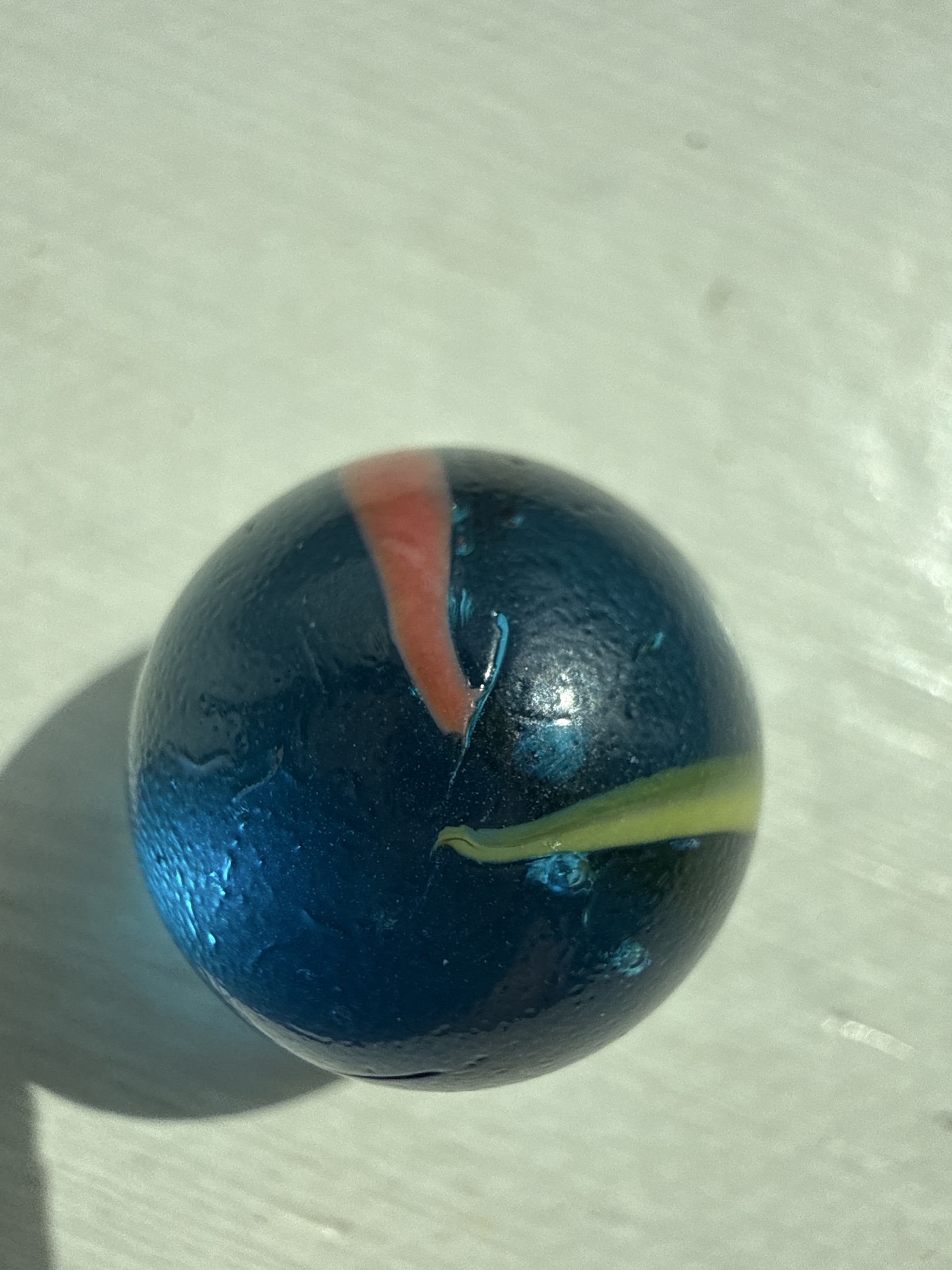 Blue Base Bicolor Cat's Eye with Red and Yellow Vanes by Vitro Agate, identification view