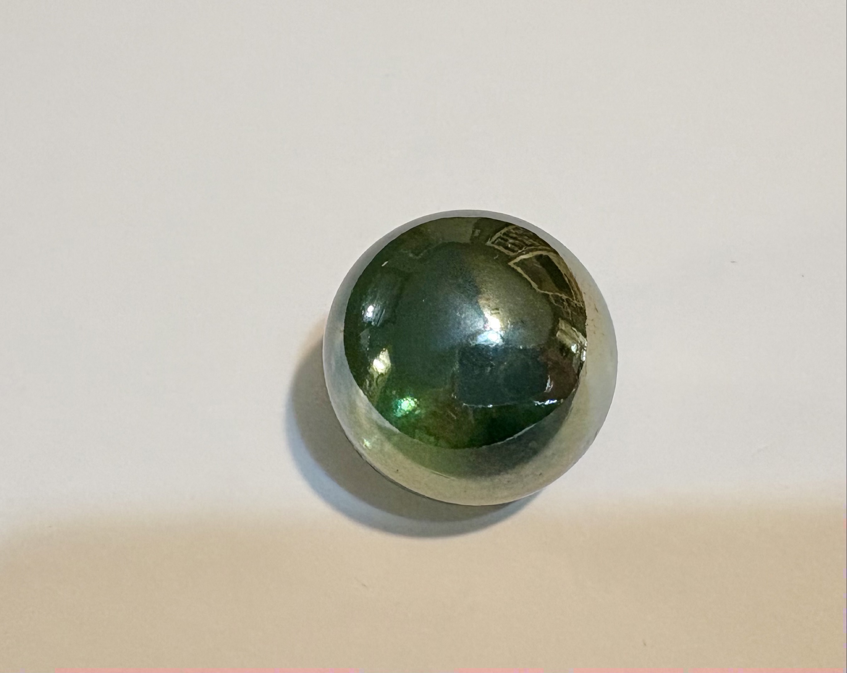 Iridescent Green Shooter by Akro Agate Company, identification view