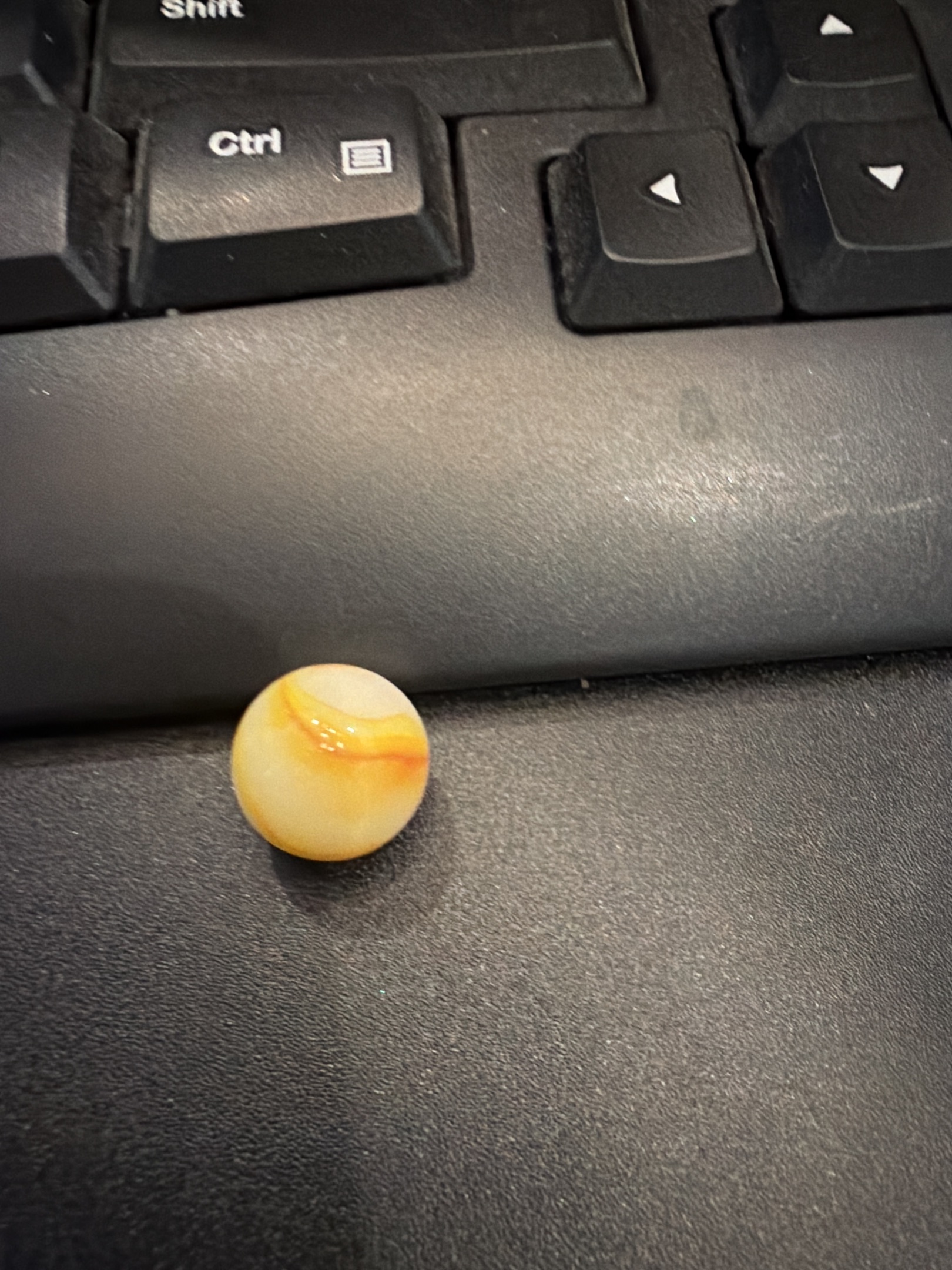 White and Yellow-Orange Swirl by Vitro Agate Company, identification view