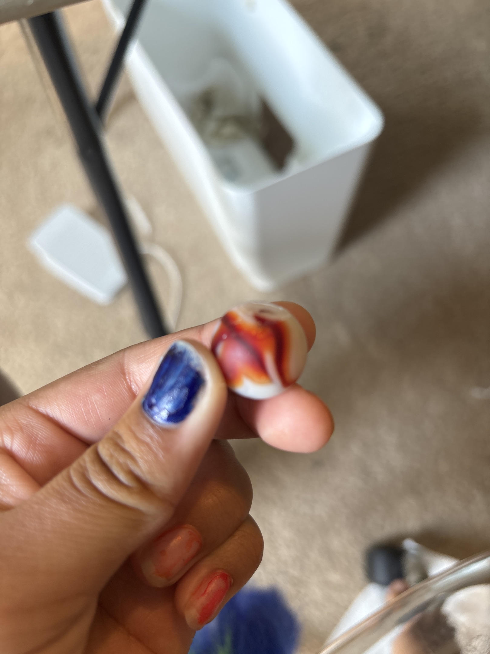 Prize Name (Red & Orange on White) by Akro Agate Company
