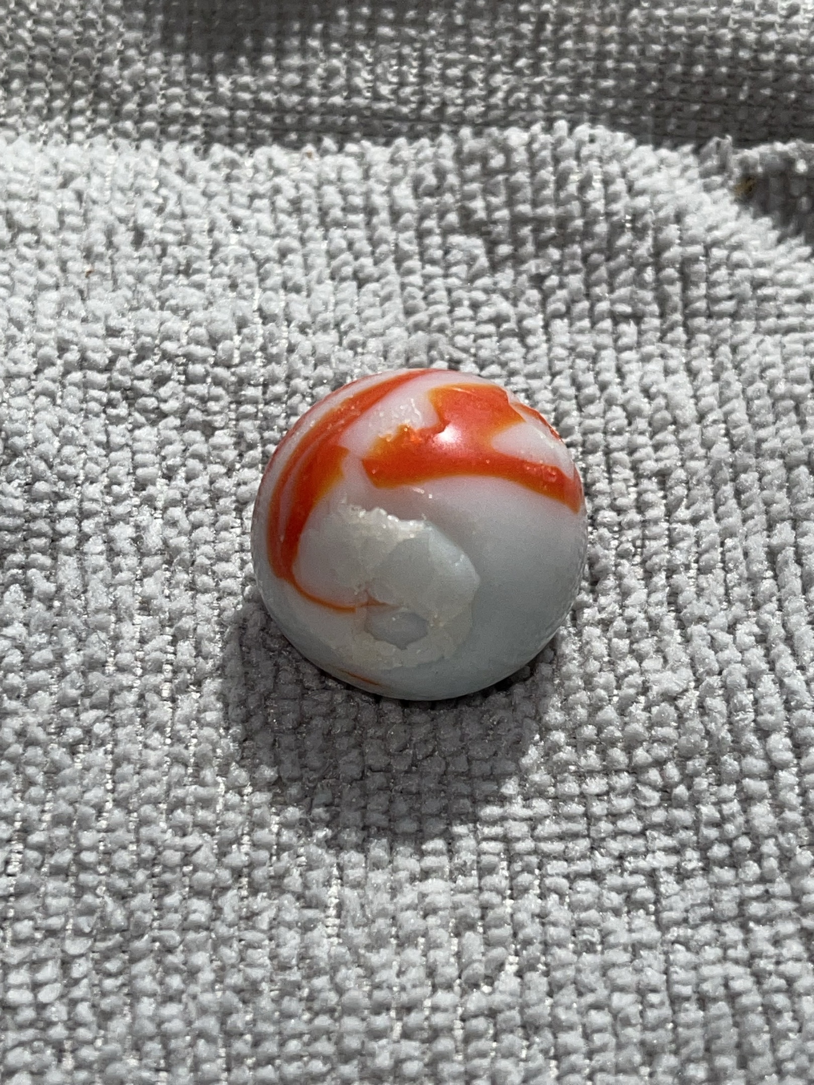 Orange and White Swirl by Akro Agate Company