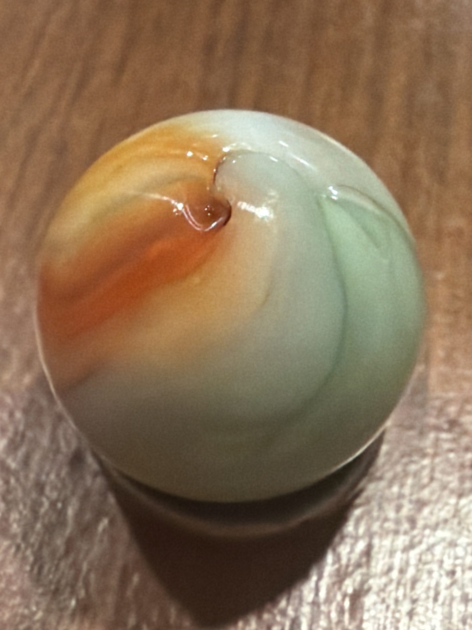 Orange and Green Corkscrew by Akro Agate Company