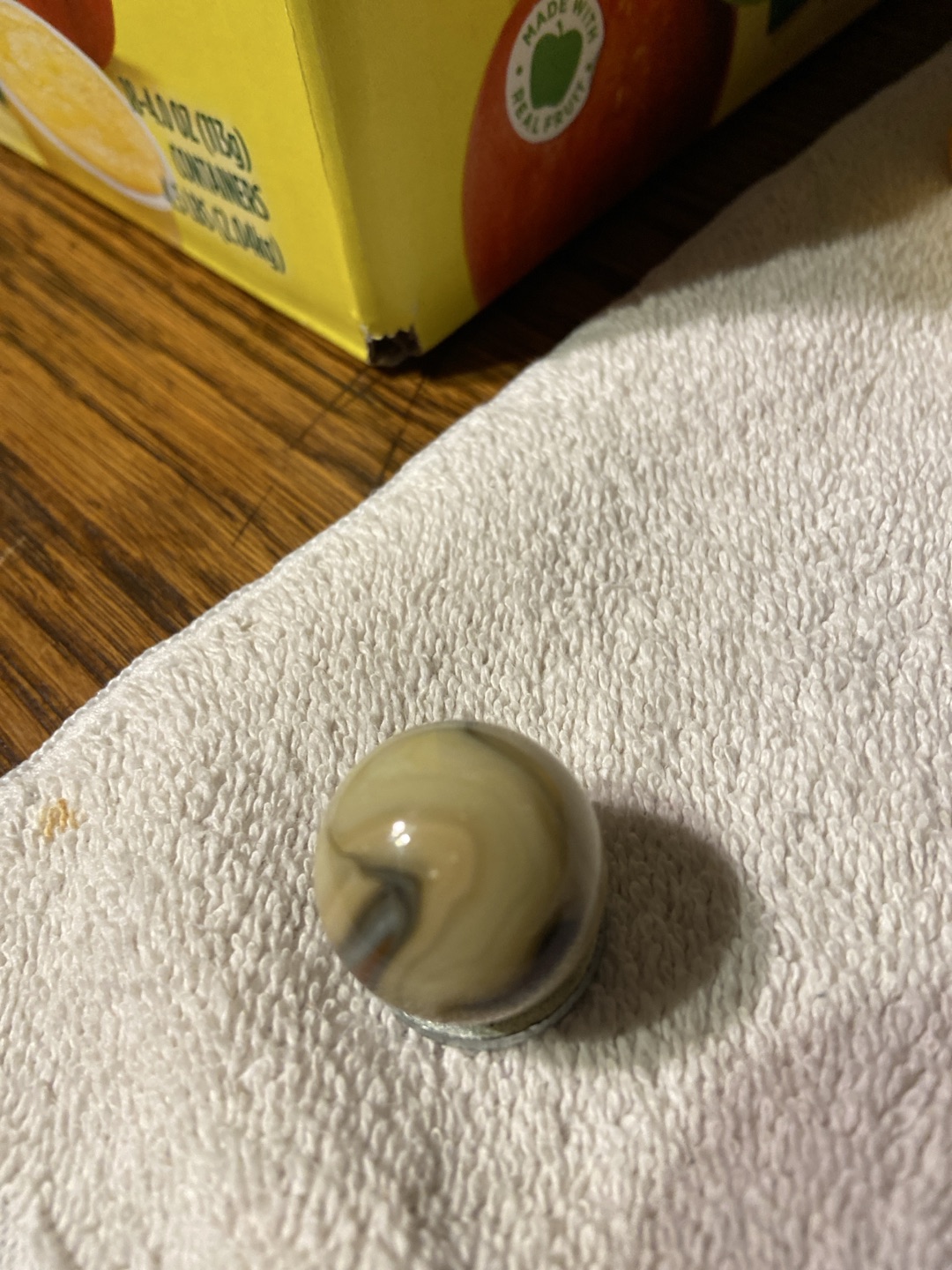 Oxblood Swirl (Cream/Tan Base) by Akro Agate Company, identification view