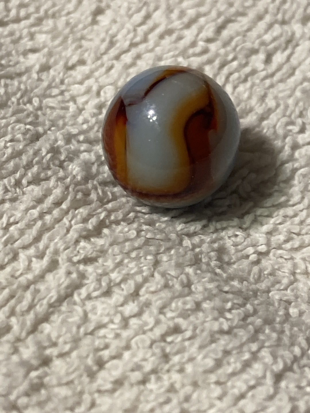 Blue/Orange Swirl with Oxblood by Akro Agate Company