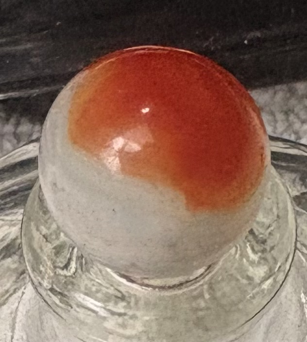 Orange Patch on Translucent White by Akro Agate Company, identification view