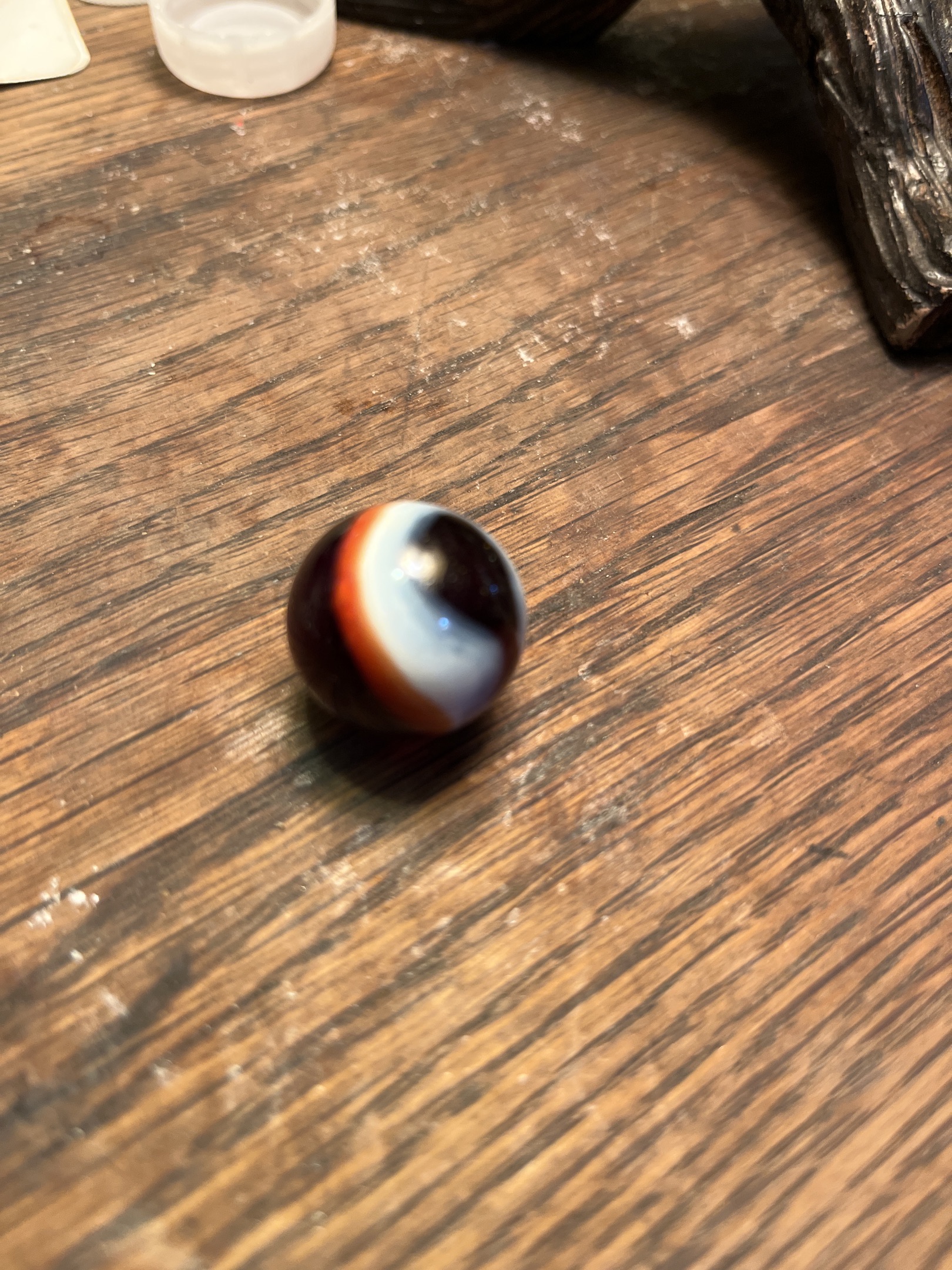 Tri-color (Black/White/Orange) by Peltier Glass Company, identification view