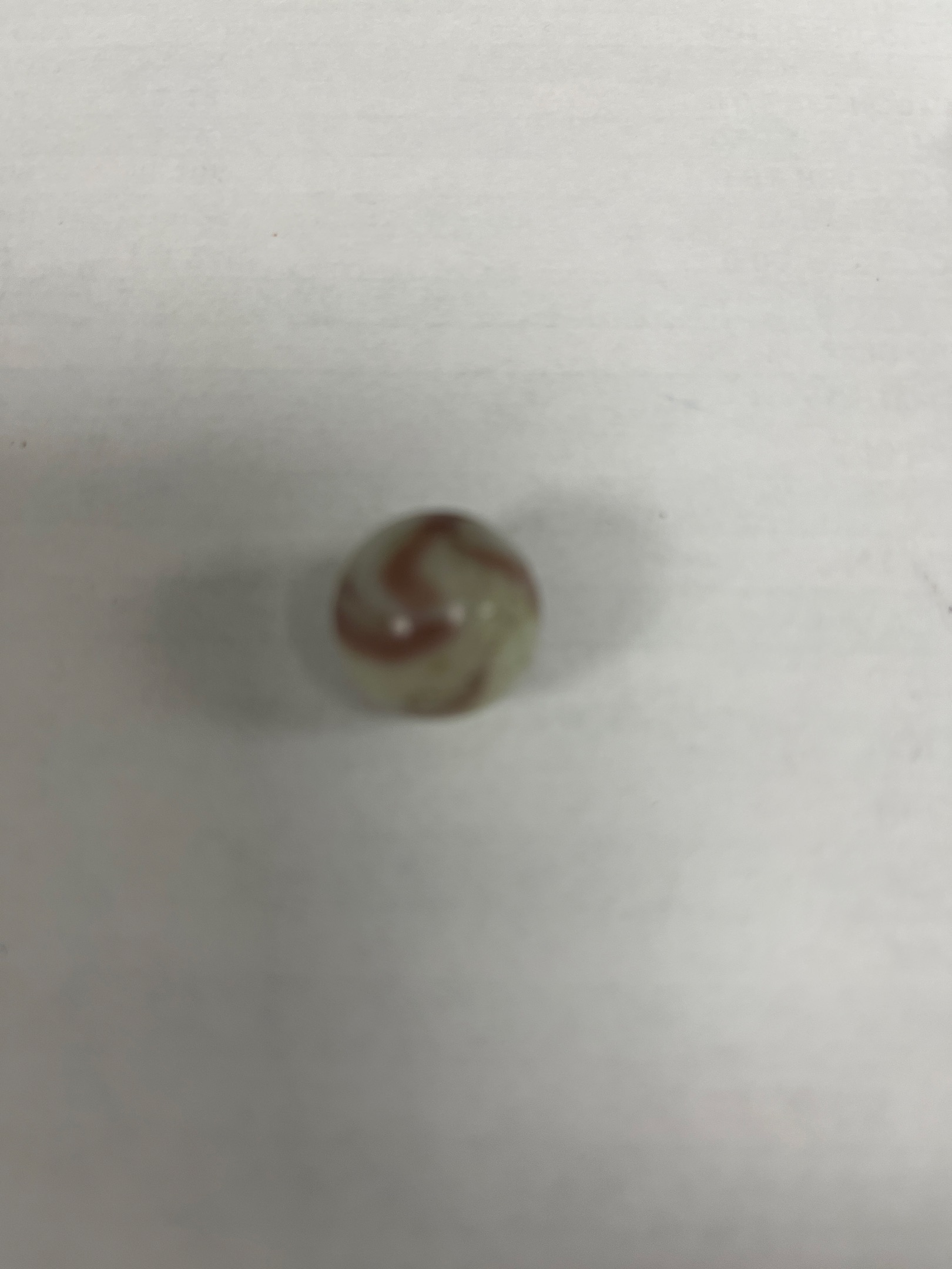 White Oxblood Swirl by Akro Agate Company, identification view