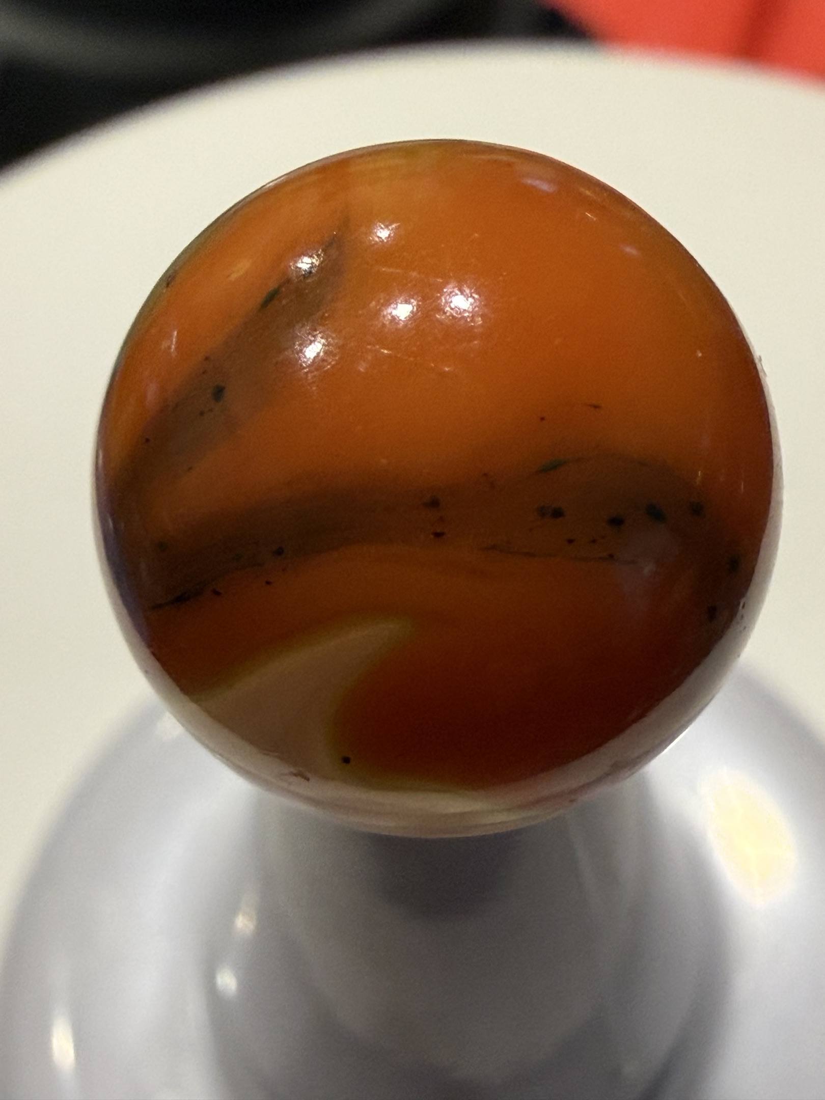 Orange & White Swirl (with Pepper) by Akro Agate Company