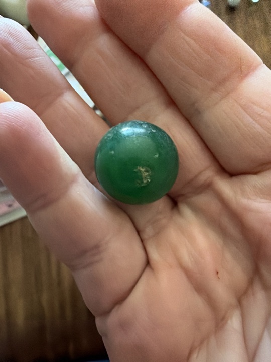Green Opaque Game Marble by Akro Agate, identification view