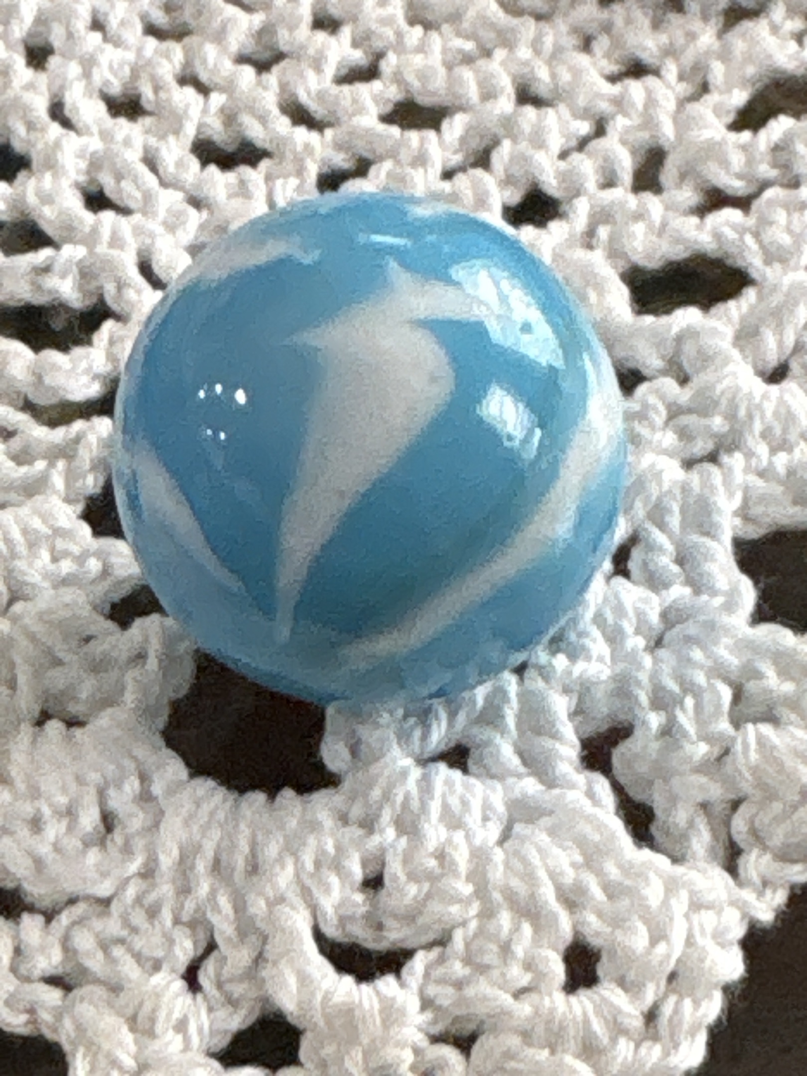 Blue and White Swirl Shooter by Akro Agate Company