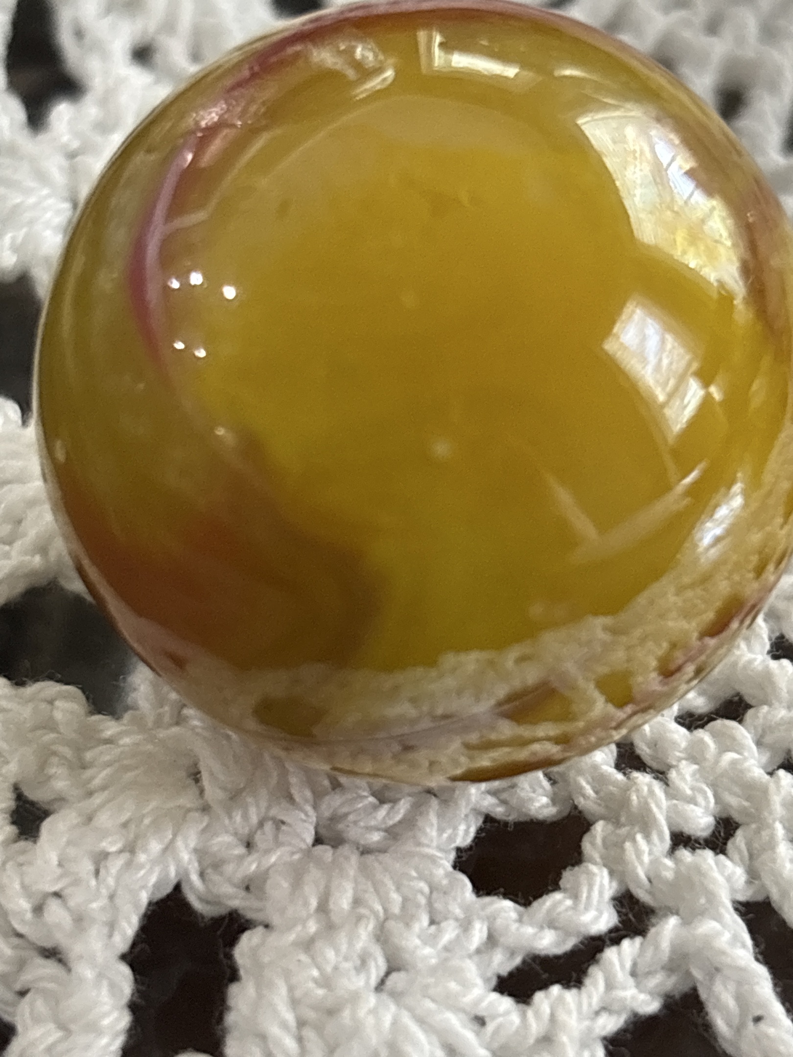 Amber Slag (Red Swirl Variant) by Akro Agate Co., identification view