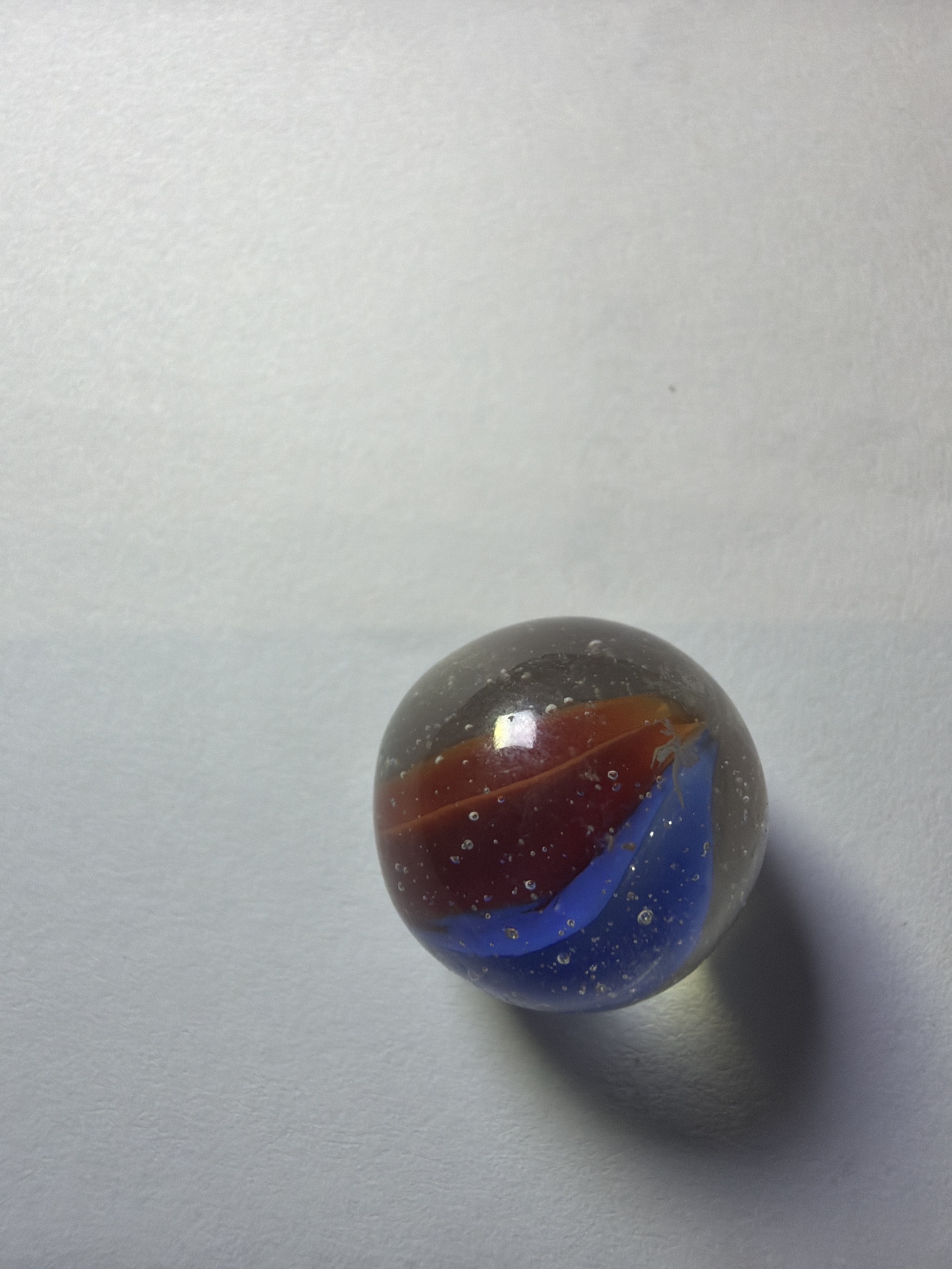 Superman - Red and Blue Two-Vane Cat's Eye by Vitro Agate, identification view