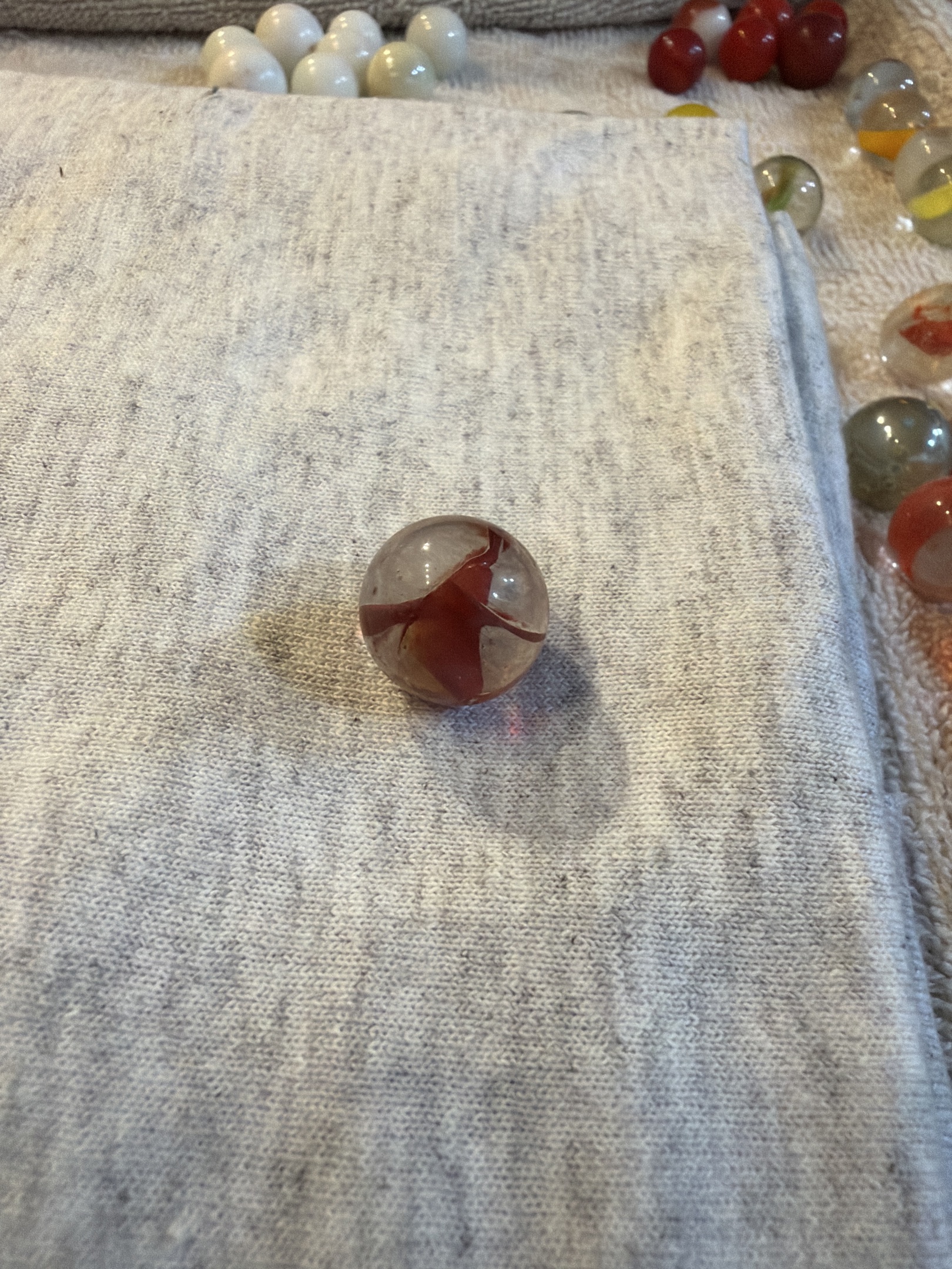 Red on Clear Cat's Eye by Vitro Agate, identification view