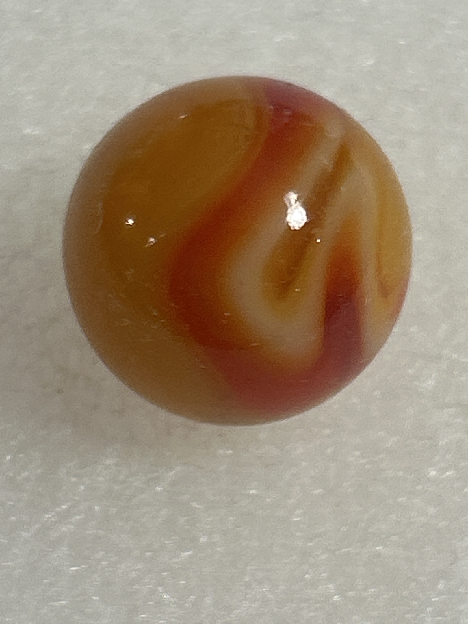 Amber-Based Red & White Swirl (Prize Name) by Akro Agate Company