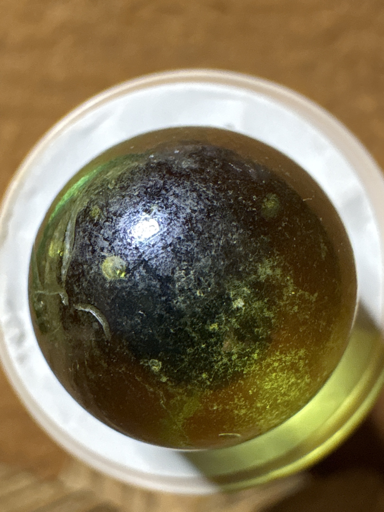 Translucent Black (Green Glow) by Akro Agate Company, identification view