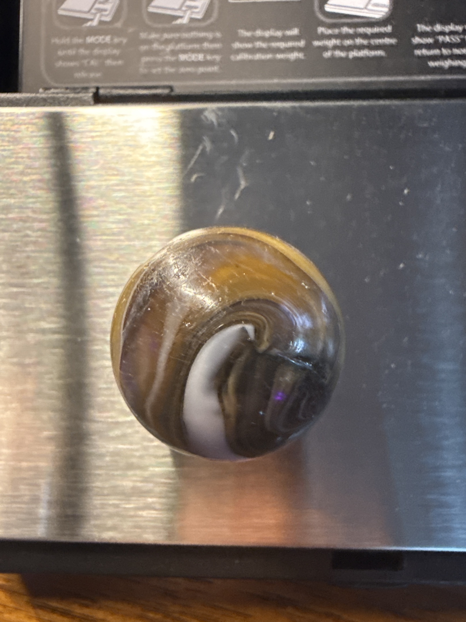 Amber Slag Shooter by Akro Agate Company, identification view