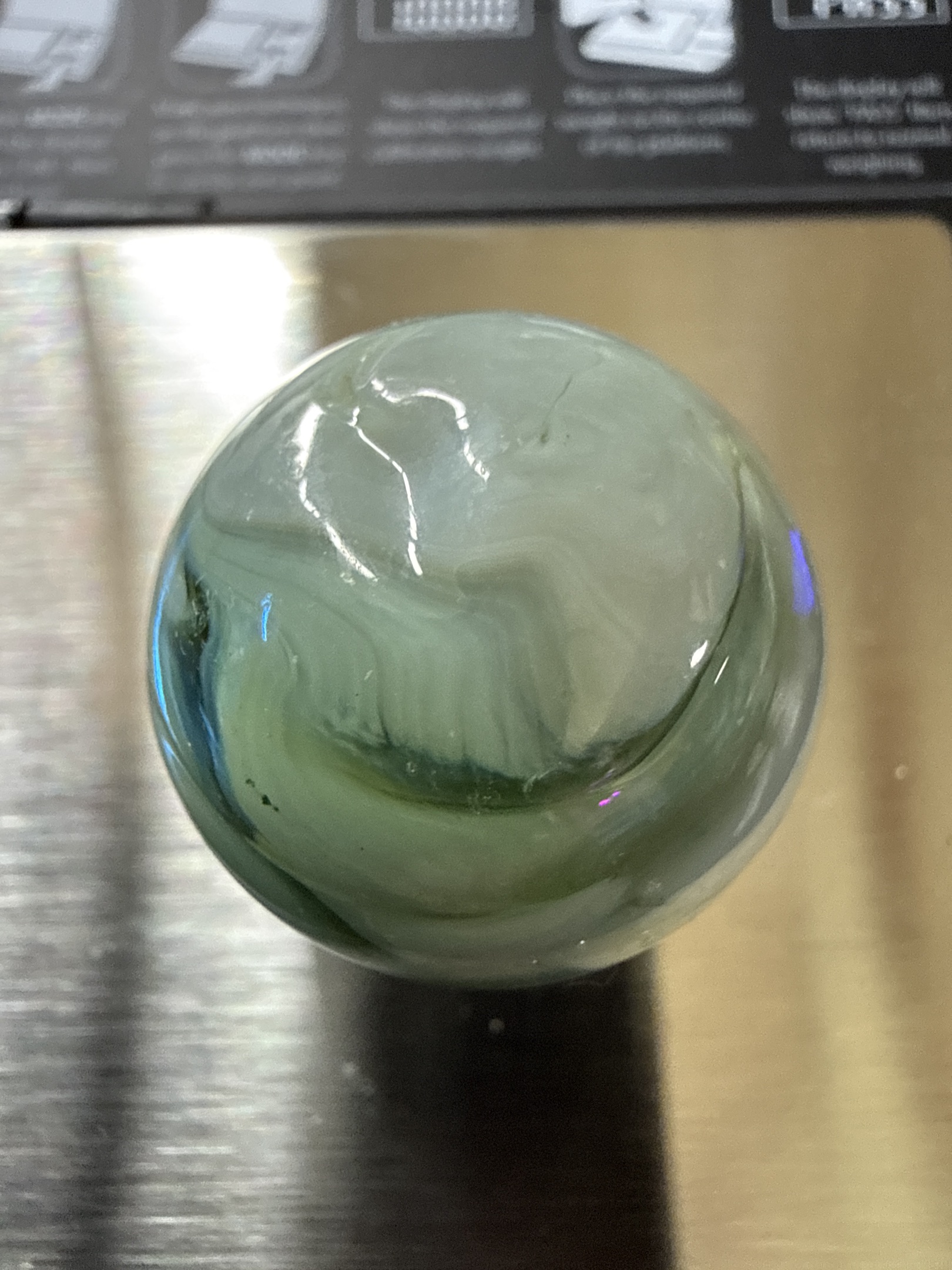 Green Slag Shooter by Akro Agate Company, identification view