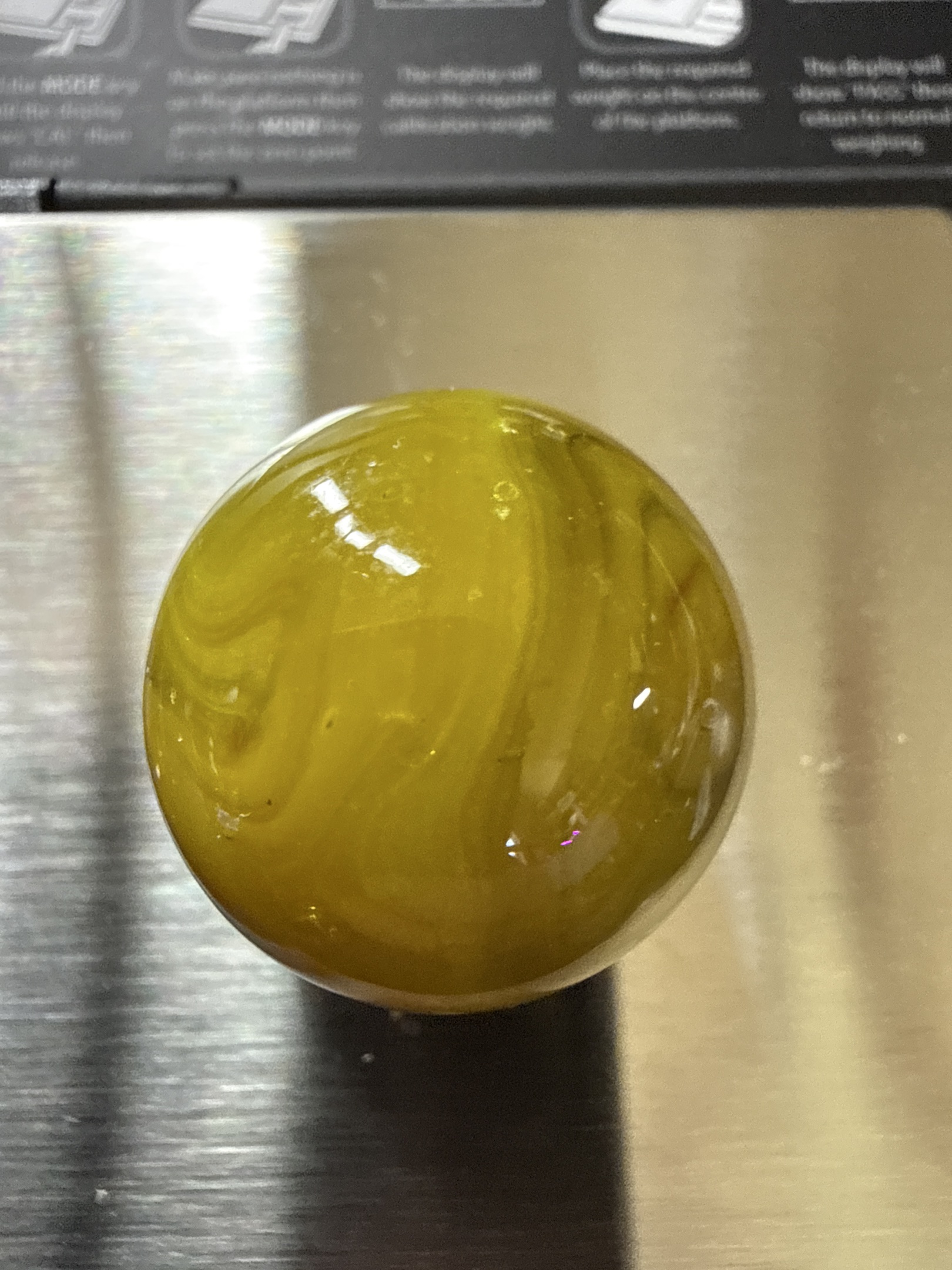 Lemonade Swirl (Shooter) by Akro Agate Company, identification view