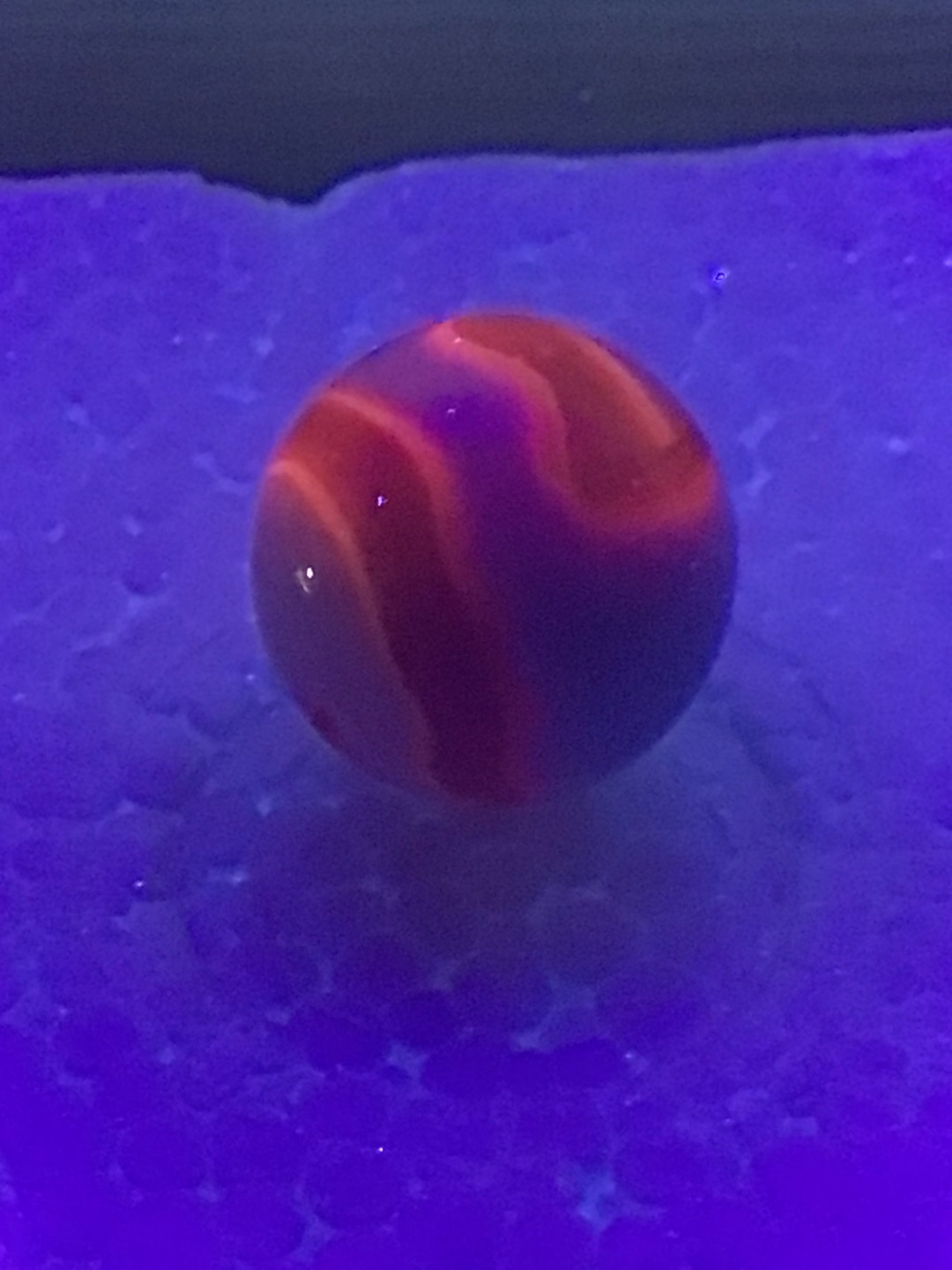 Red and White Swirl (UV Reactive / Glower) by Akro Agate Company