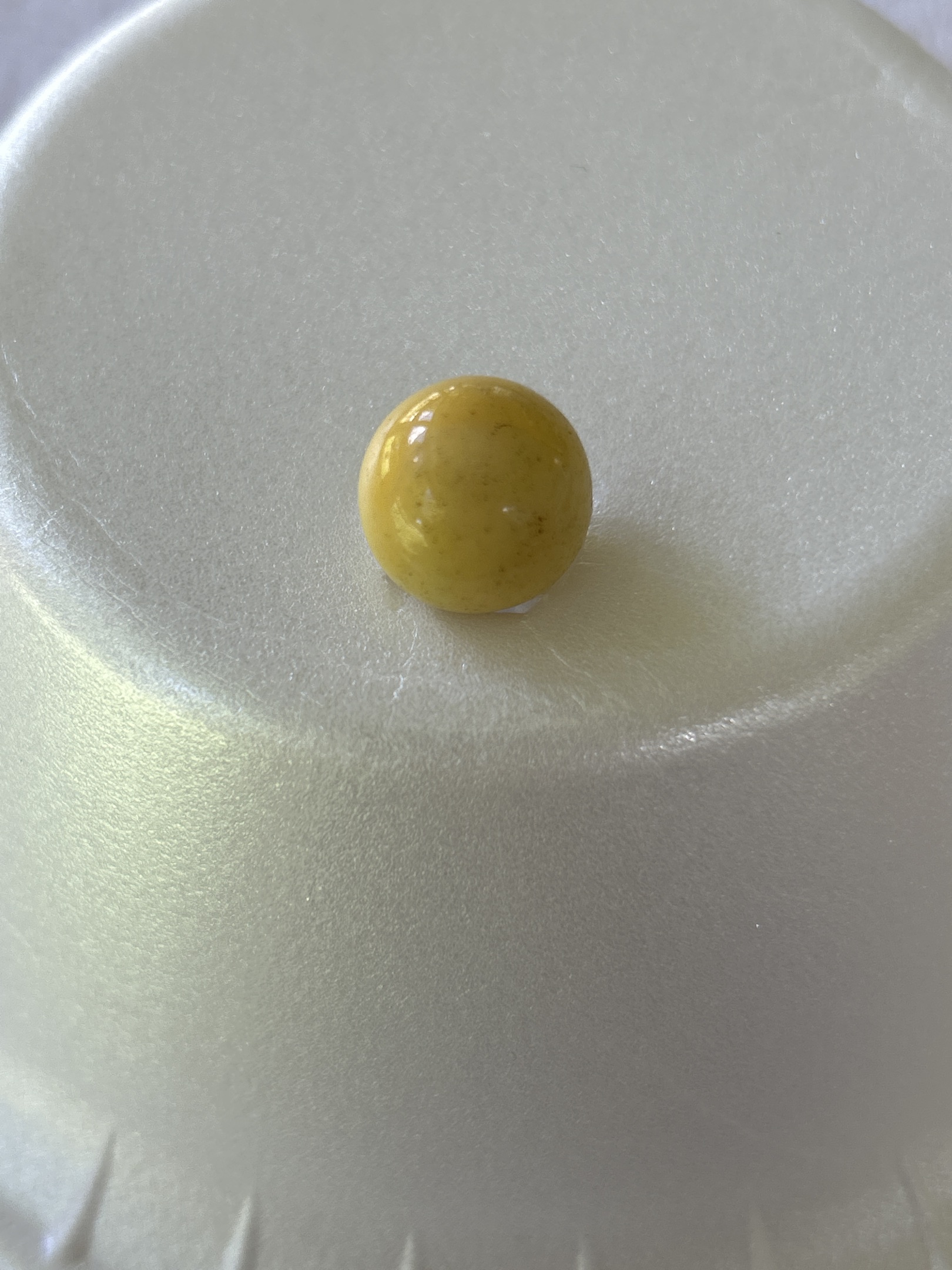 Yellow Game Marble by Akro Agate Company, identification view