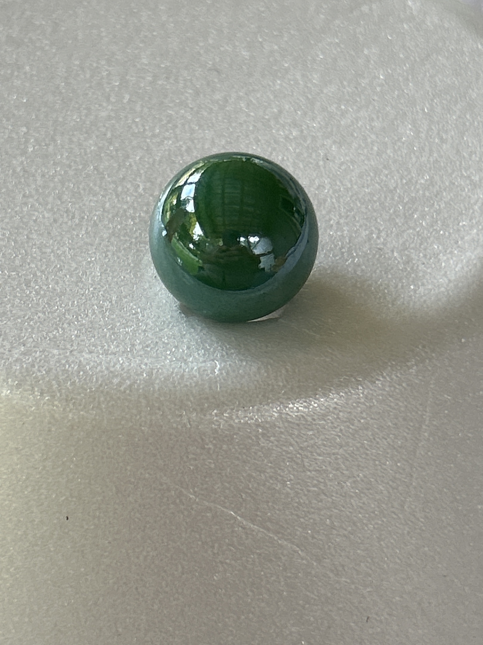 Dark Green Game Marble by Vitro Agate Company, identification view