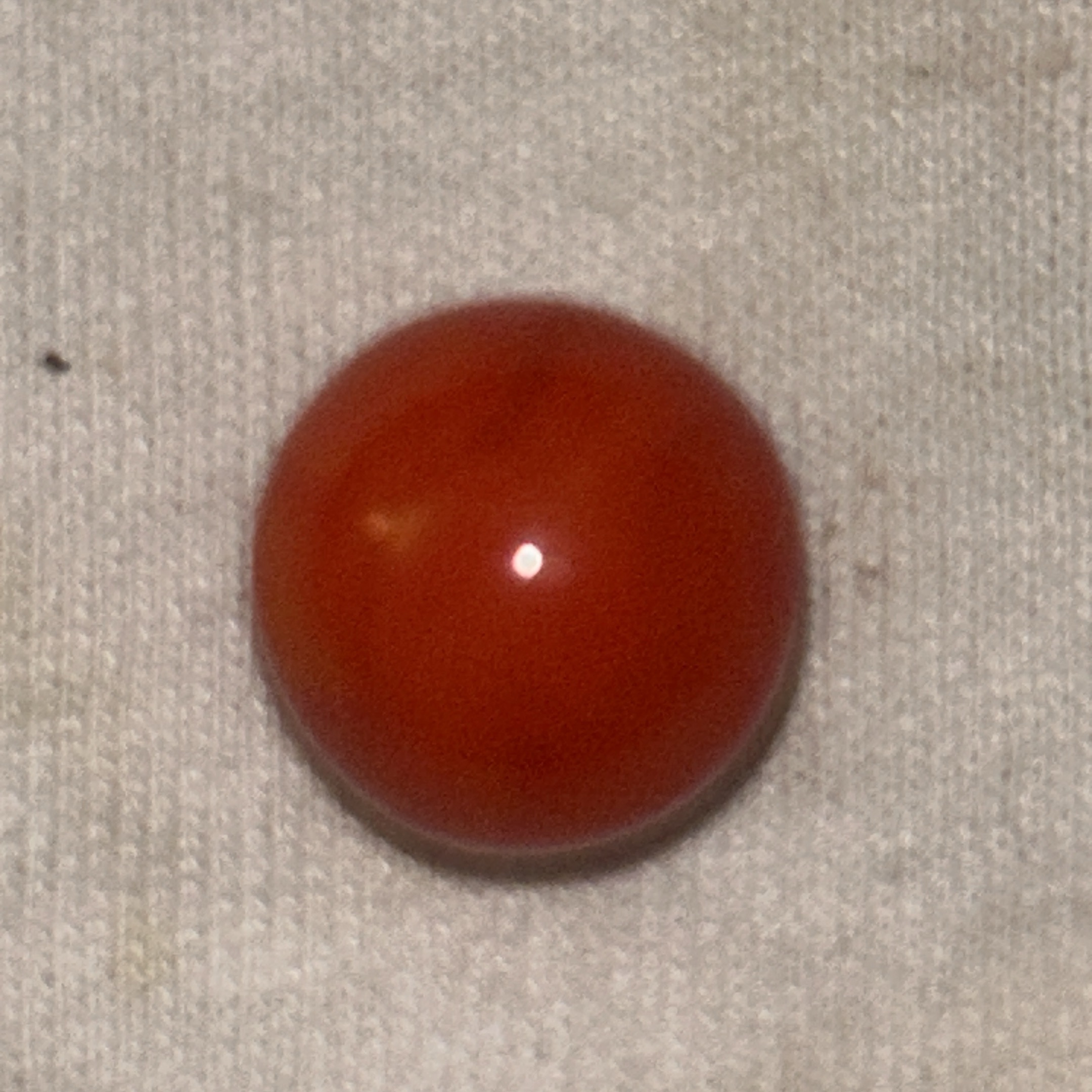 Red-Orange Game Marble by Akro Agate Company, identification view