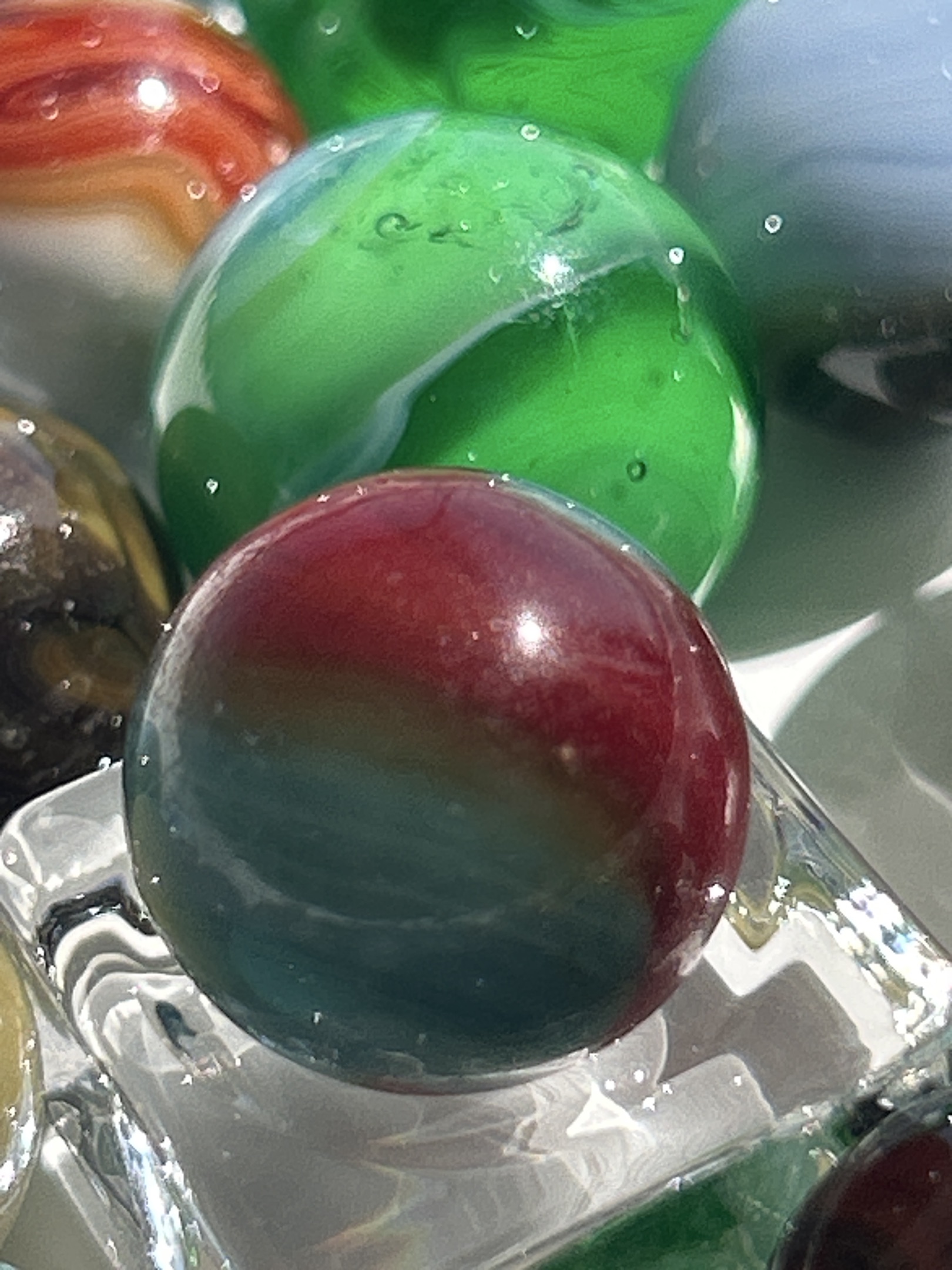 Red and Teal Bicolor Cat's Eye by Vitro Agate, identification view