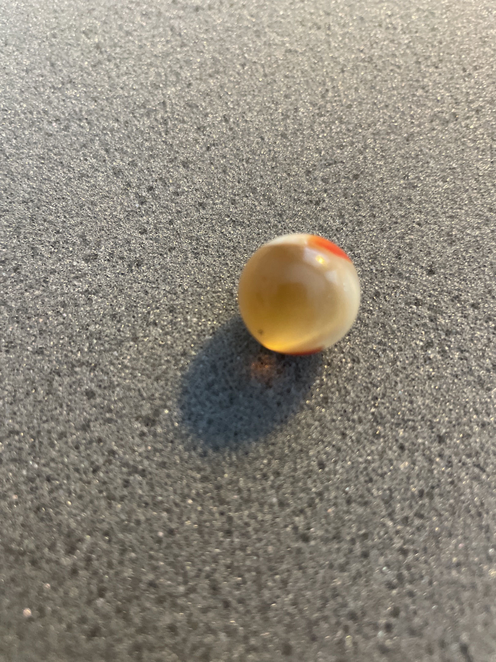 Red and White on Amber Base by Akro Agate Company