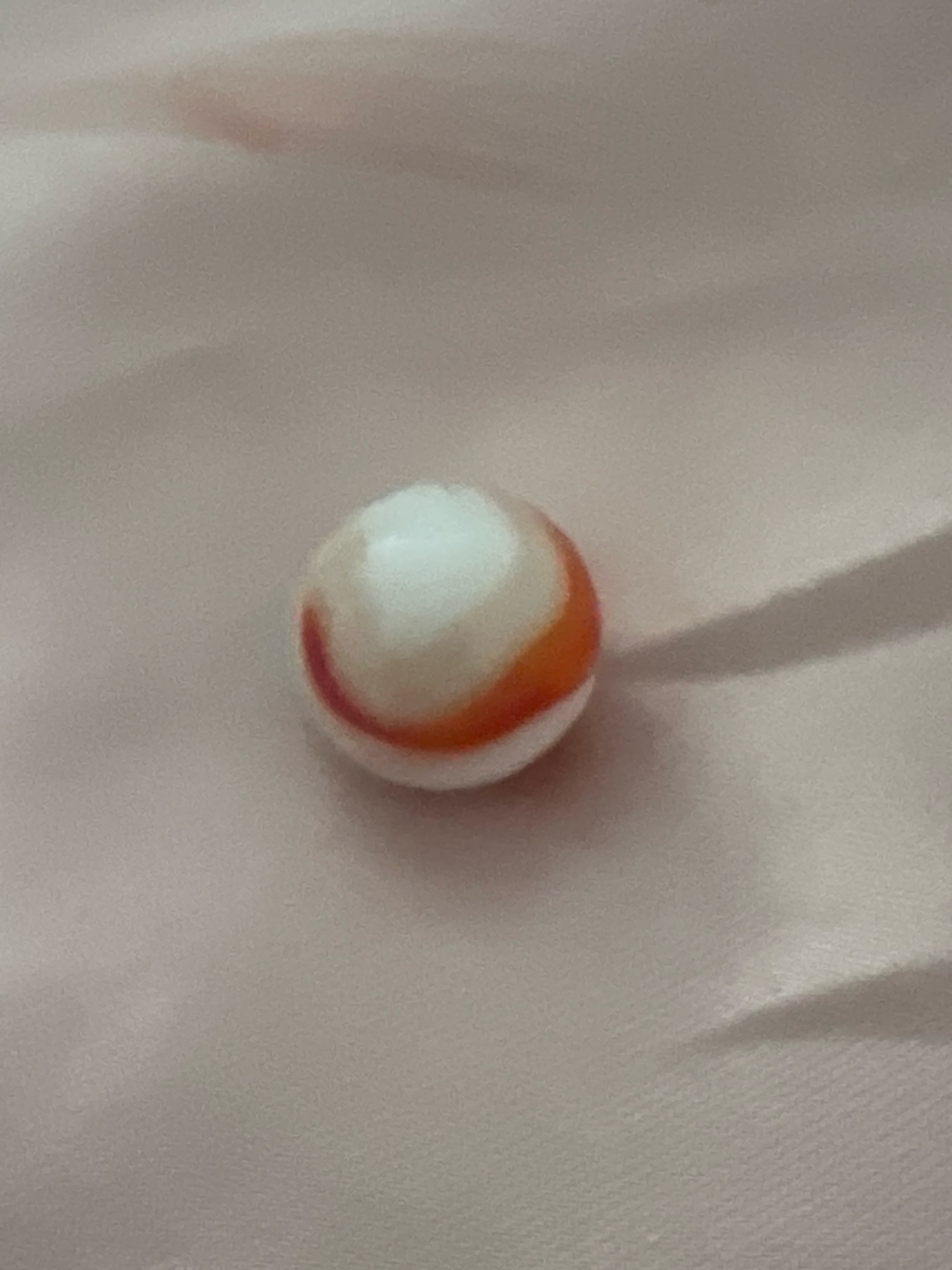 Orange and White Corkscrew by Akro Agate Company, identification view