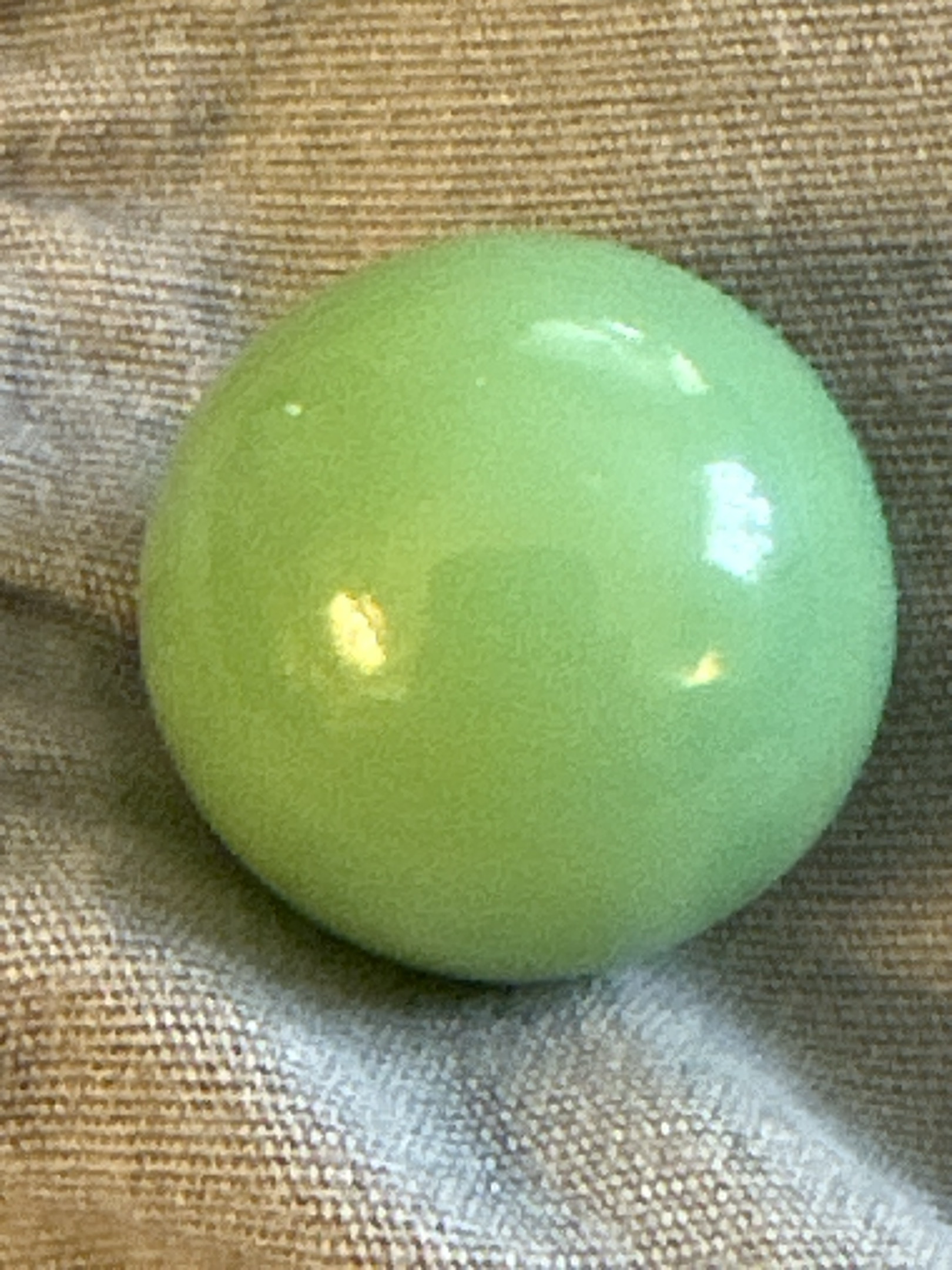 Lime Green Game Marble by Akro Agate Company, identification view