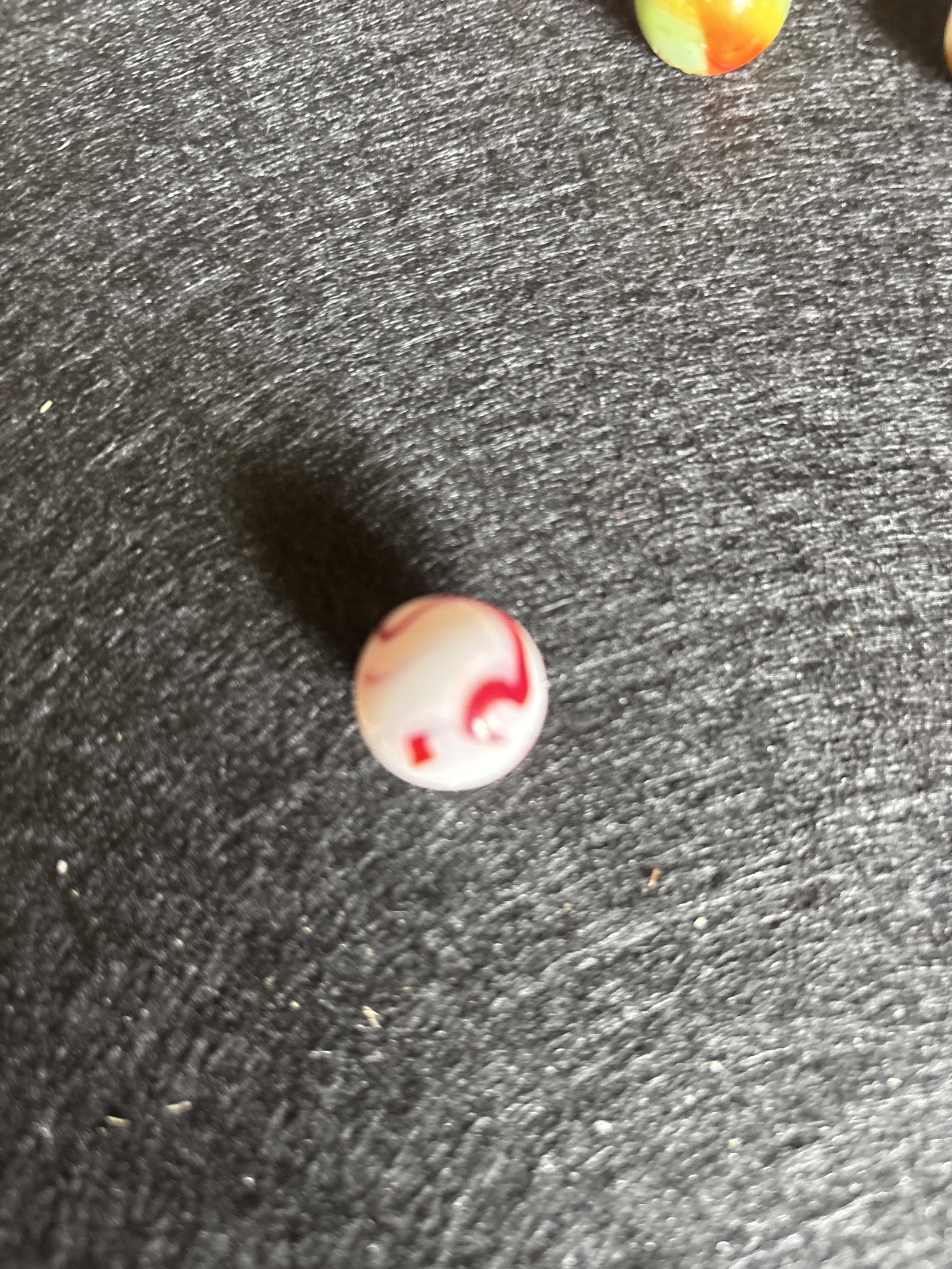Cherry Swirl - White with Red Ribbon by Vitro Agate, identification view