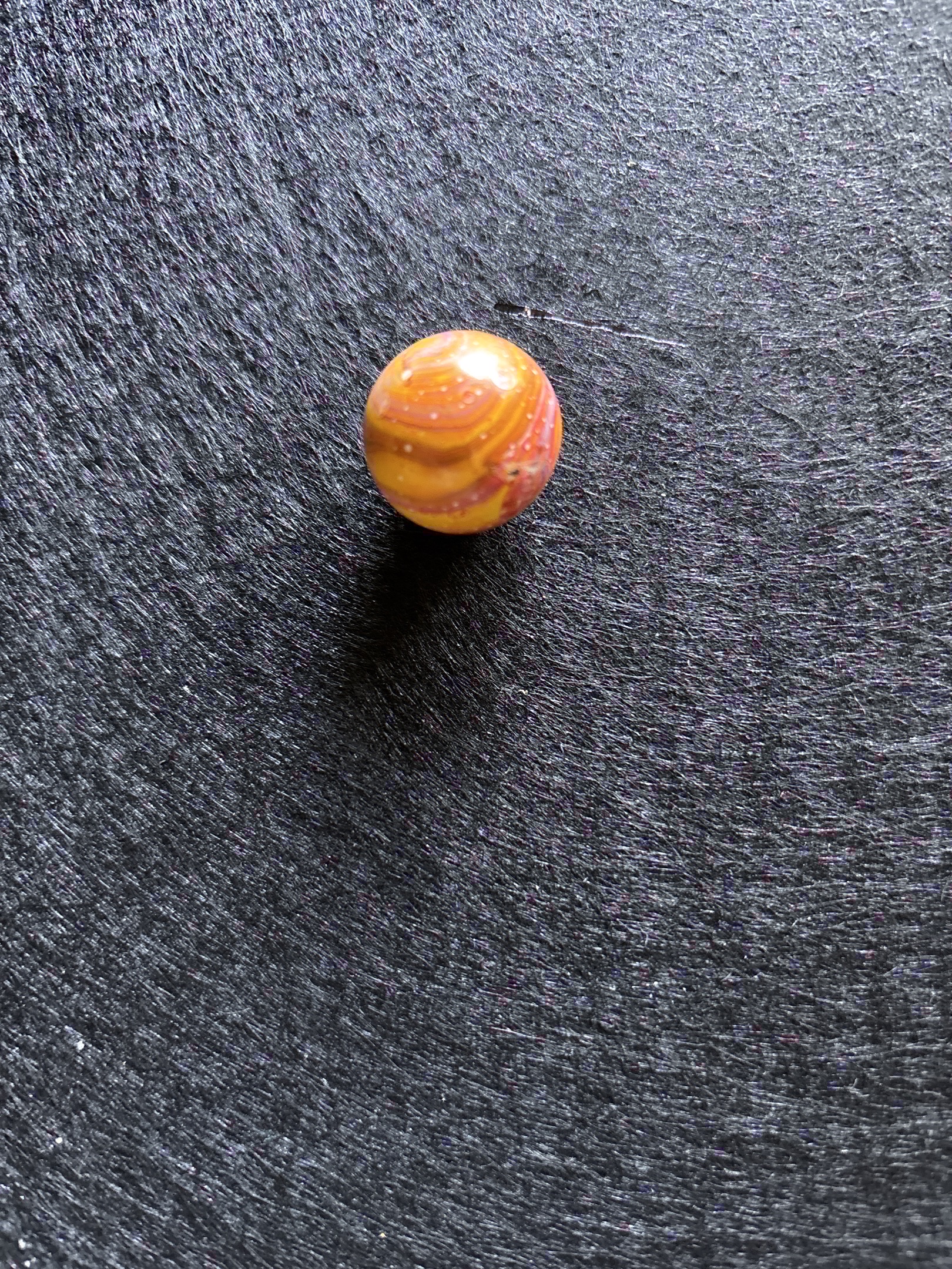 Flintie Special - Orange with Pink Swirl by Akro Agate, identification view