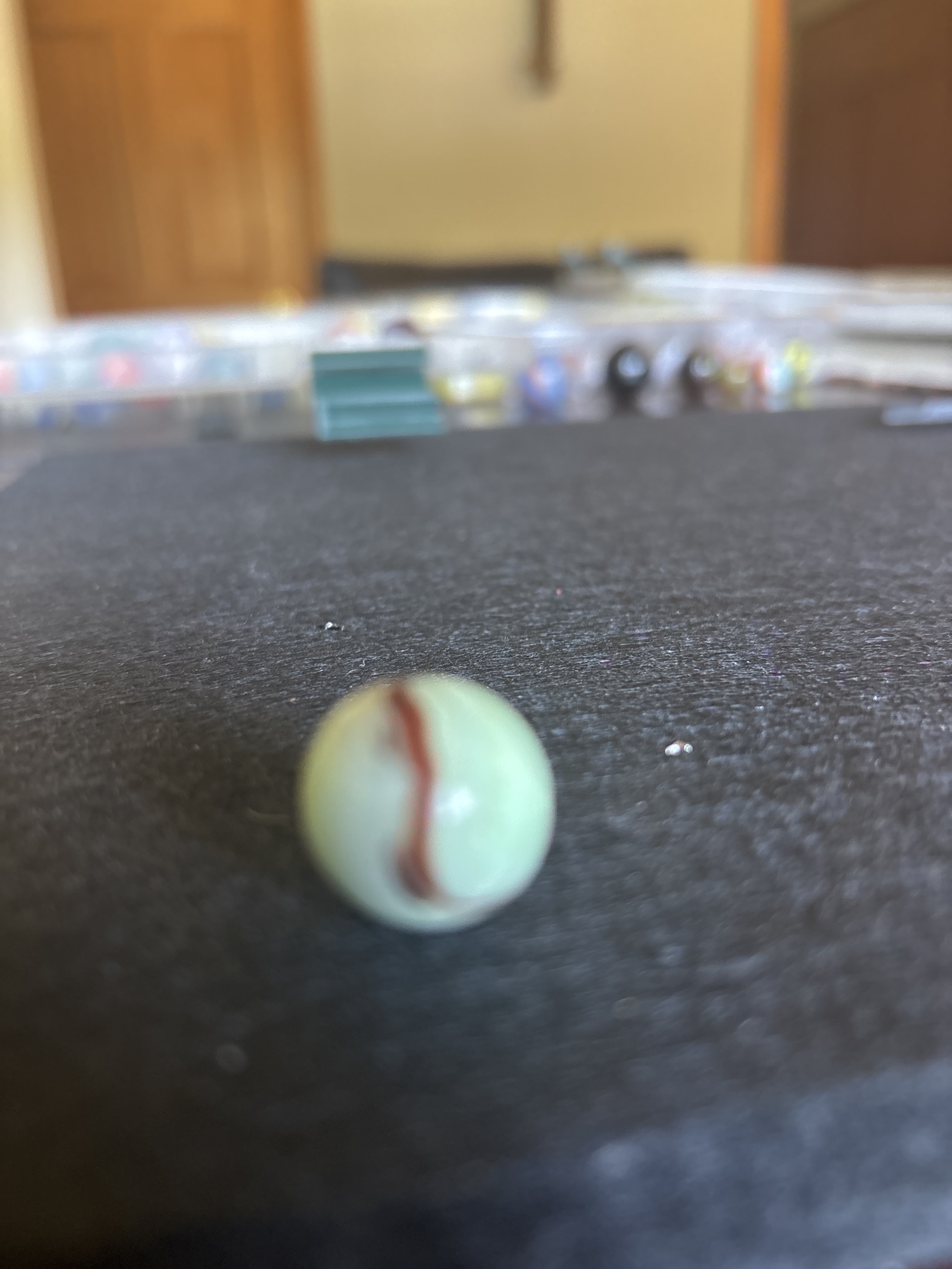 Single-Stripe Corkscrew Special - White with Red by Akro Agate, identification view