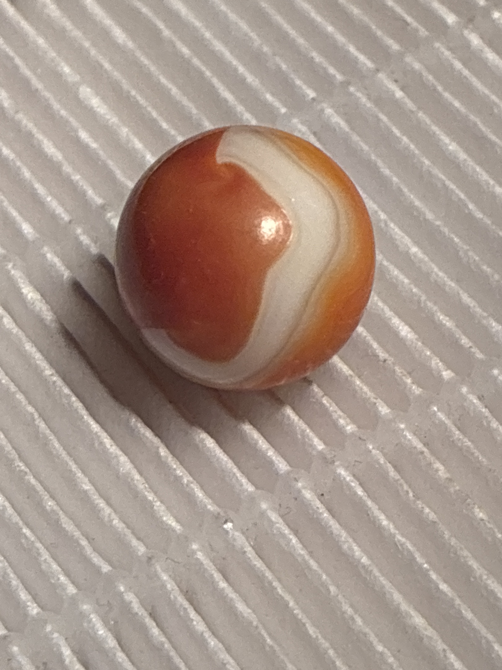 Orange Carnelian Swirl by Akro Agate Company, identification view