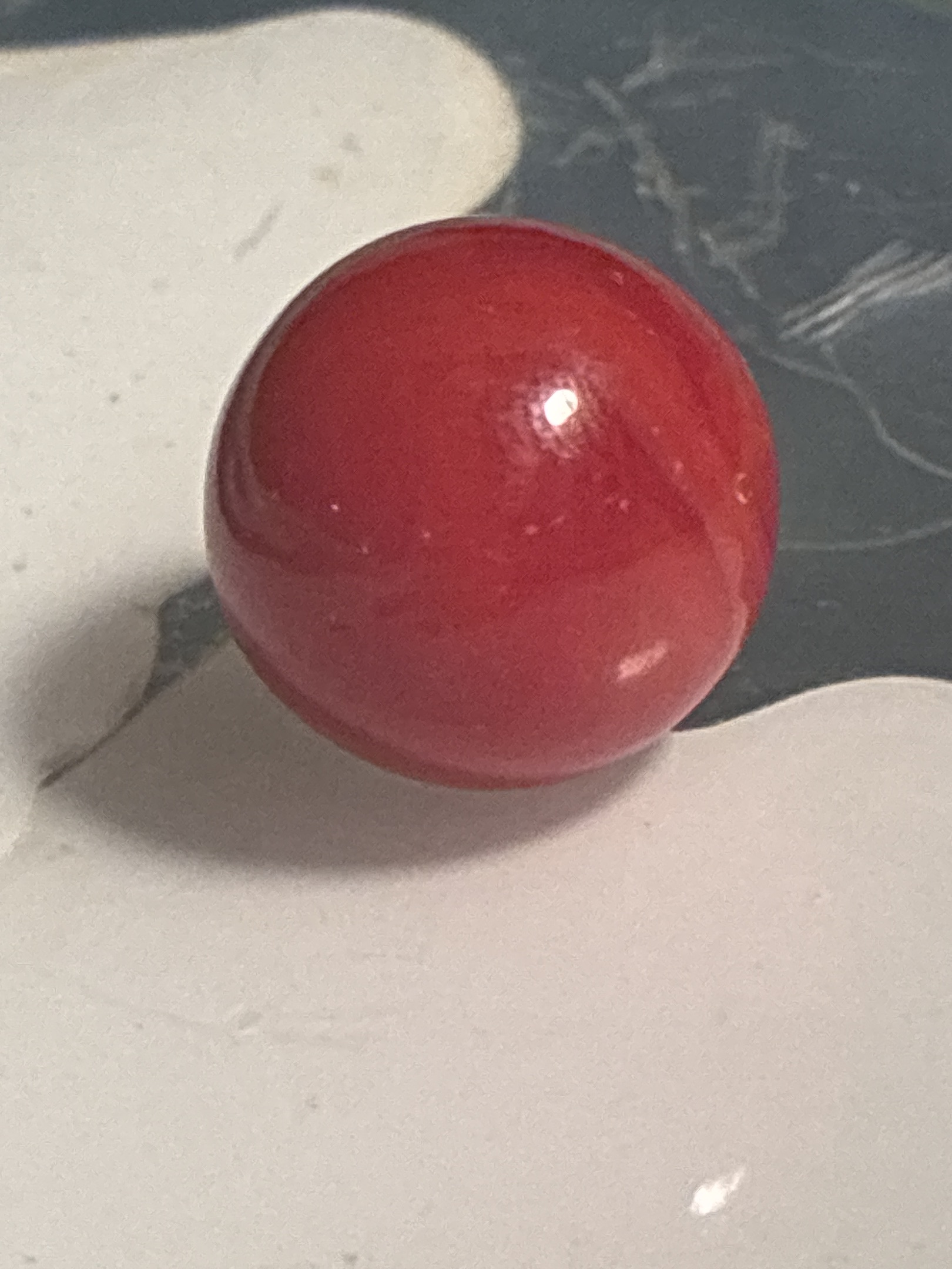Solid Red Game Marble by Akro Agate, identification view