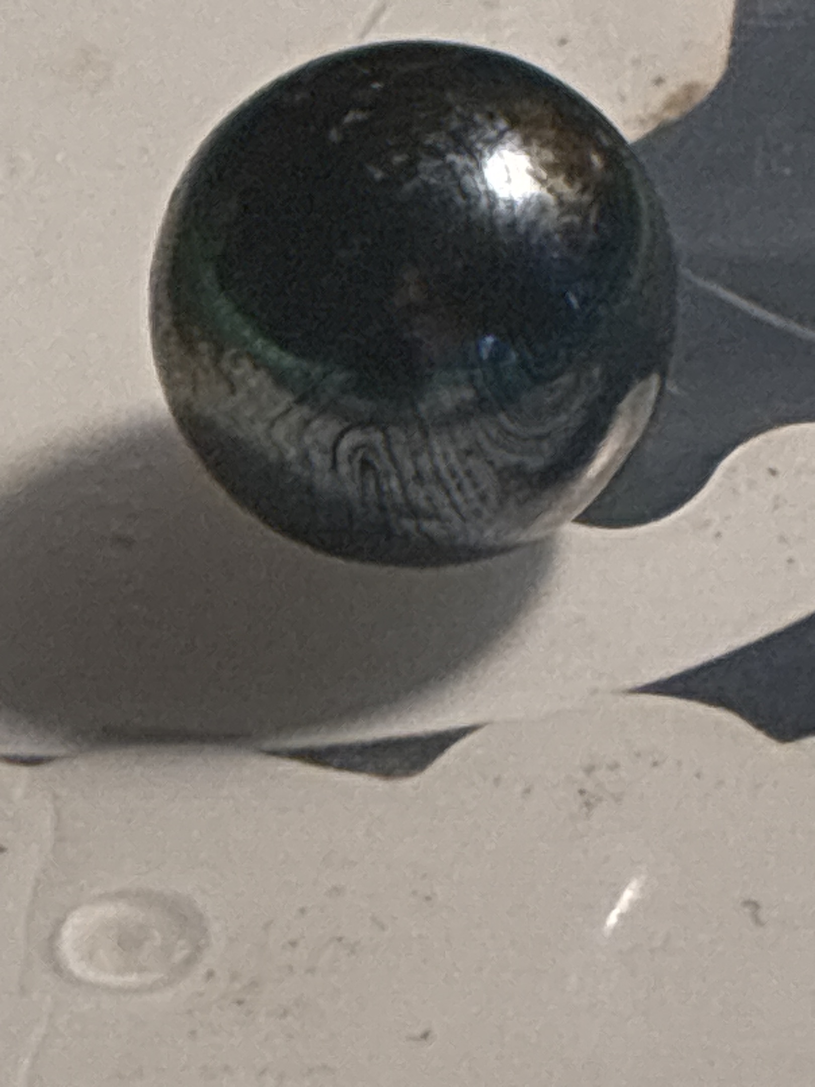 Iridescent Black Swirl by JABO Inc., identification view