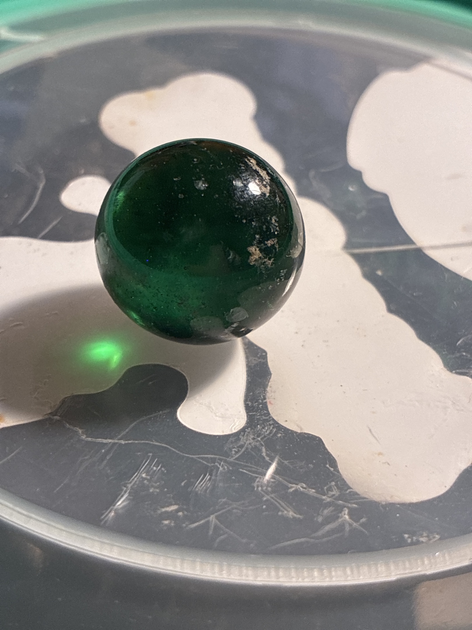 Transparent Green Shooter by Akro Agate Company, identification view