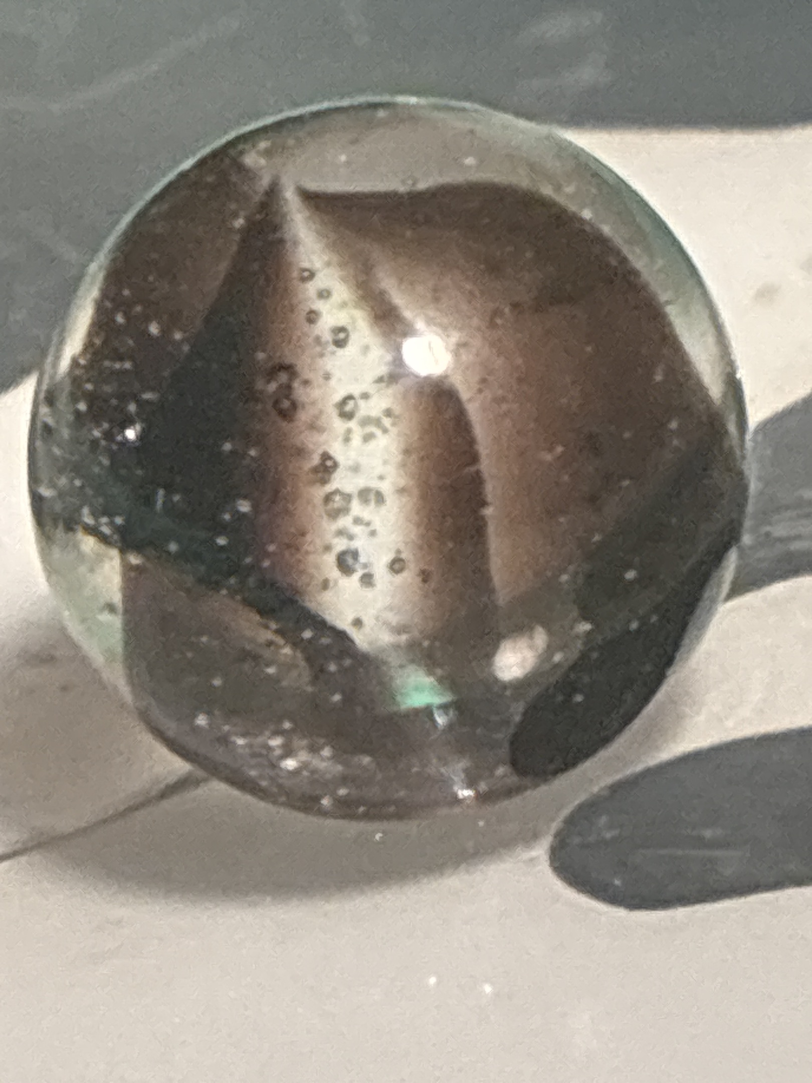 All-Red / Brownish-Red Cage Cat's Eye by Vitro Agate Company, identification view