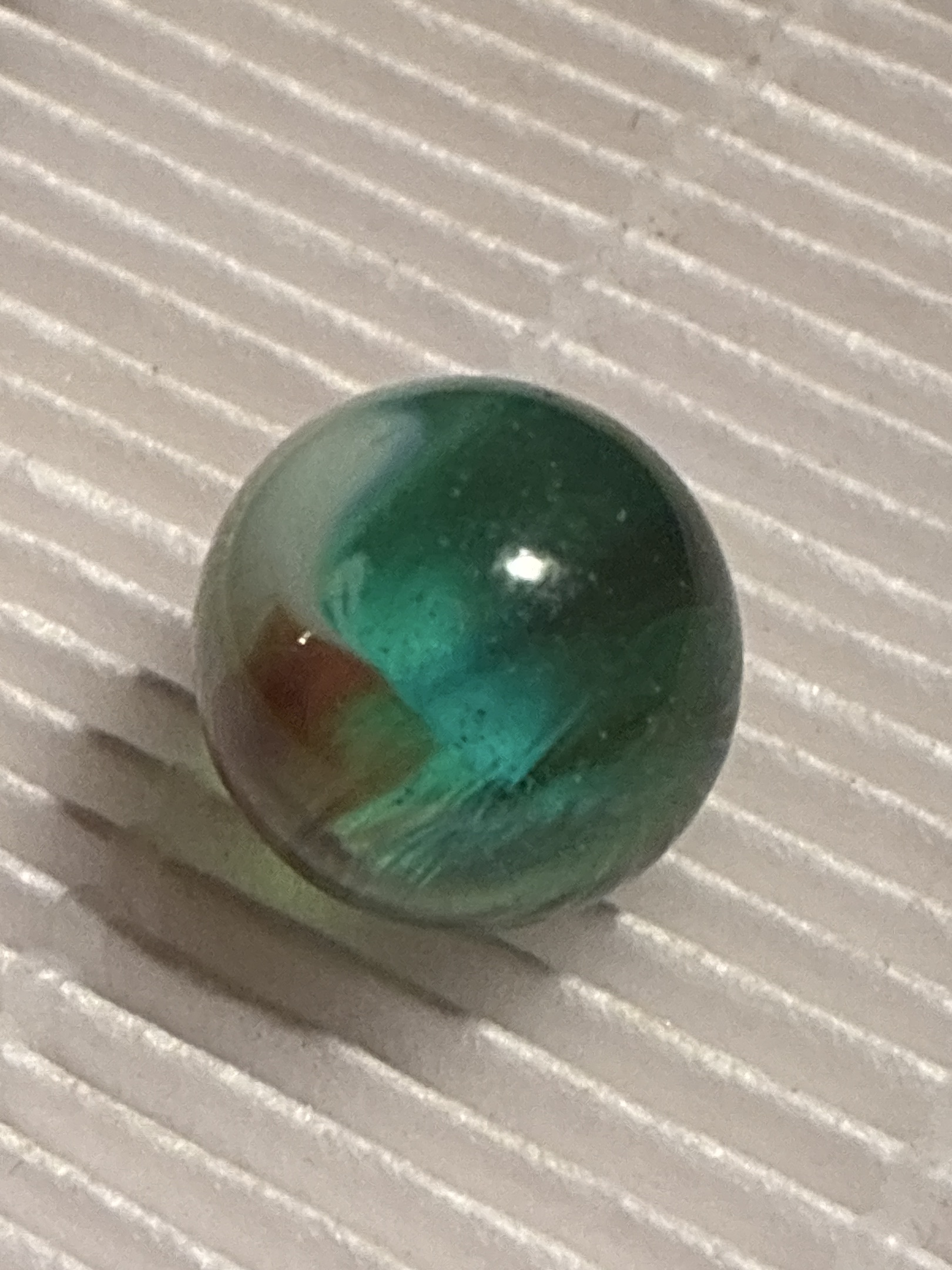 Dual Color Cat's Eye (Green & Red) by Vitro Agate Company, identification view
