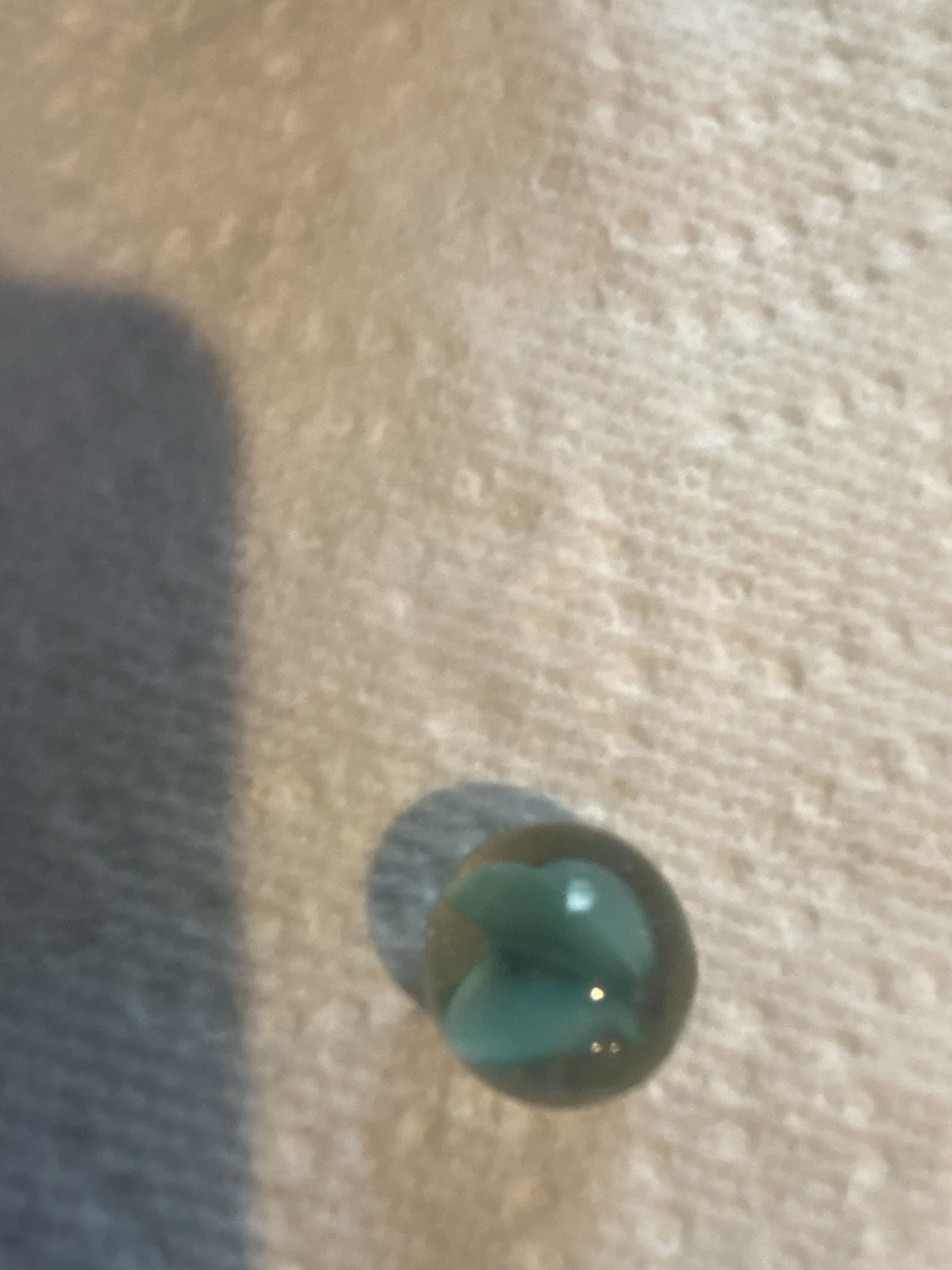 4-Blade Green Cat's Eye by Vitro Agate Company, identification view