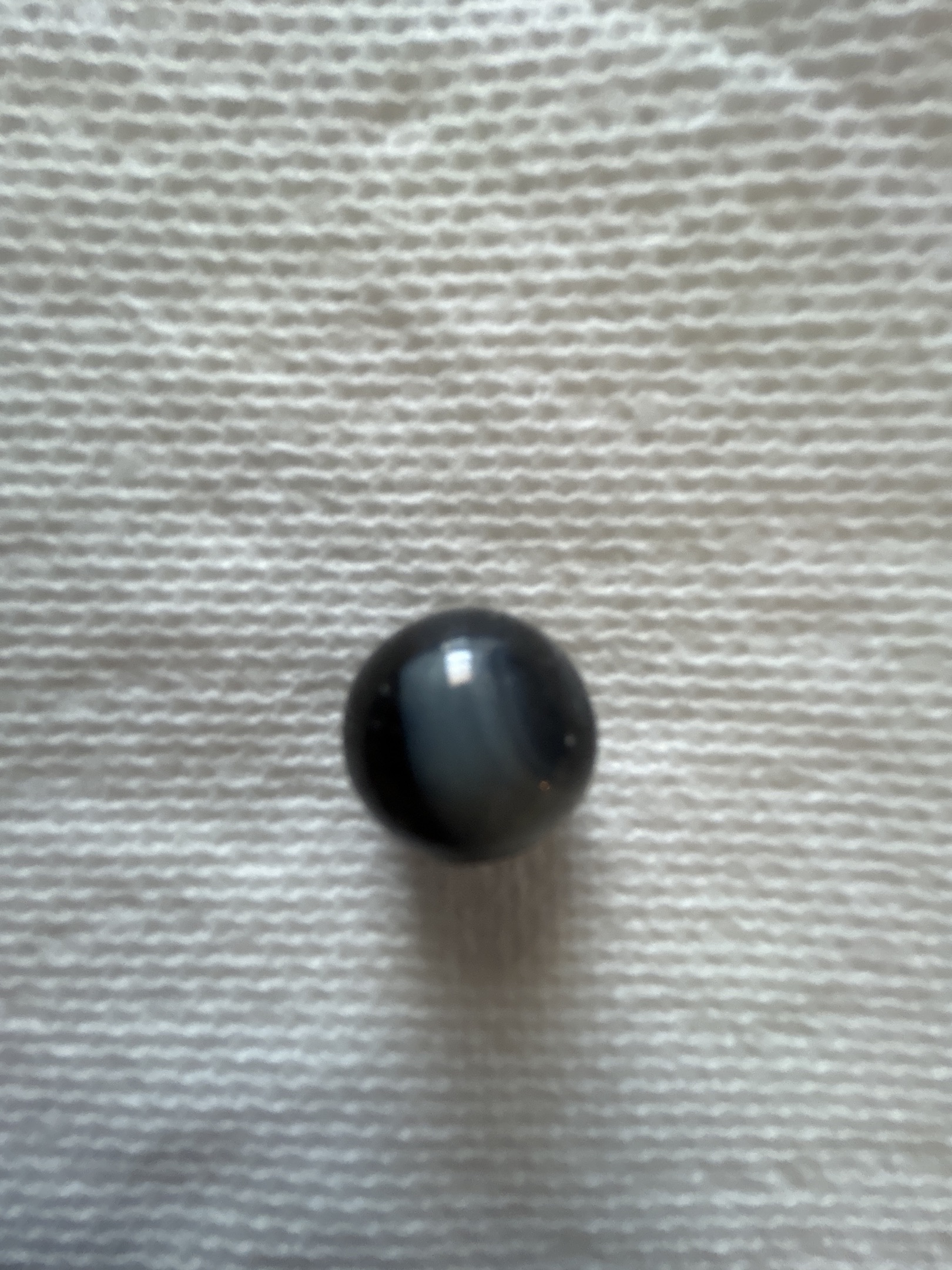 Blackie - Black Cat's Eye with White Vane by Vitro Agate, identification view