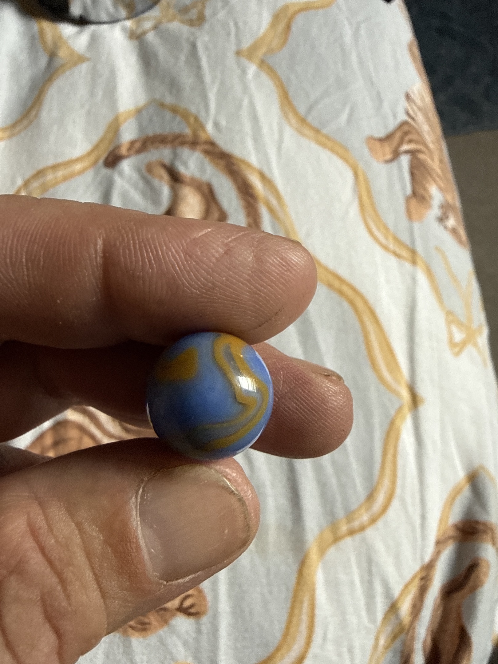 Blue Opaque with Butterscotch Yellow Swirl - Blue Egg Yolk type by Akro Agate, identification view