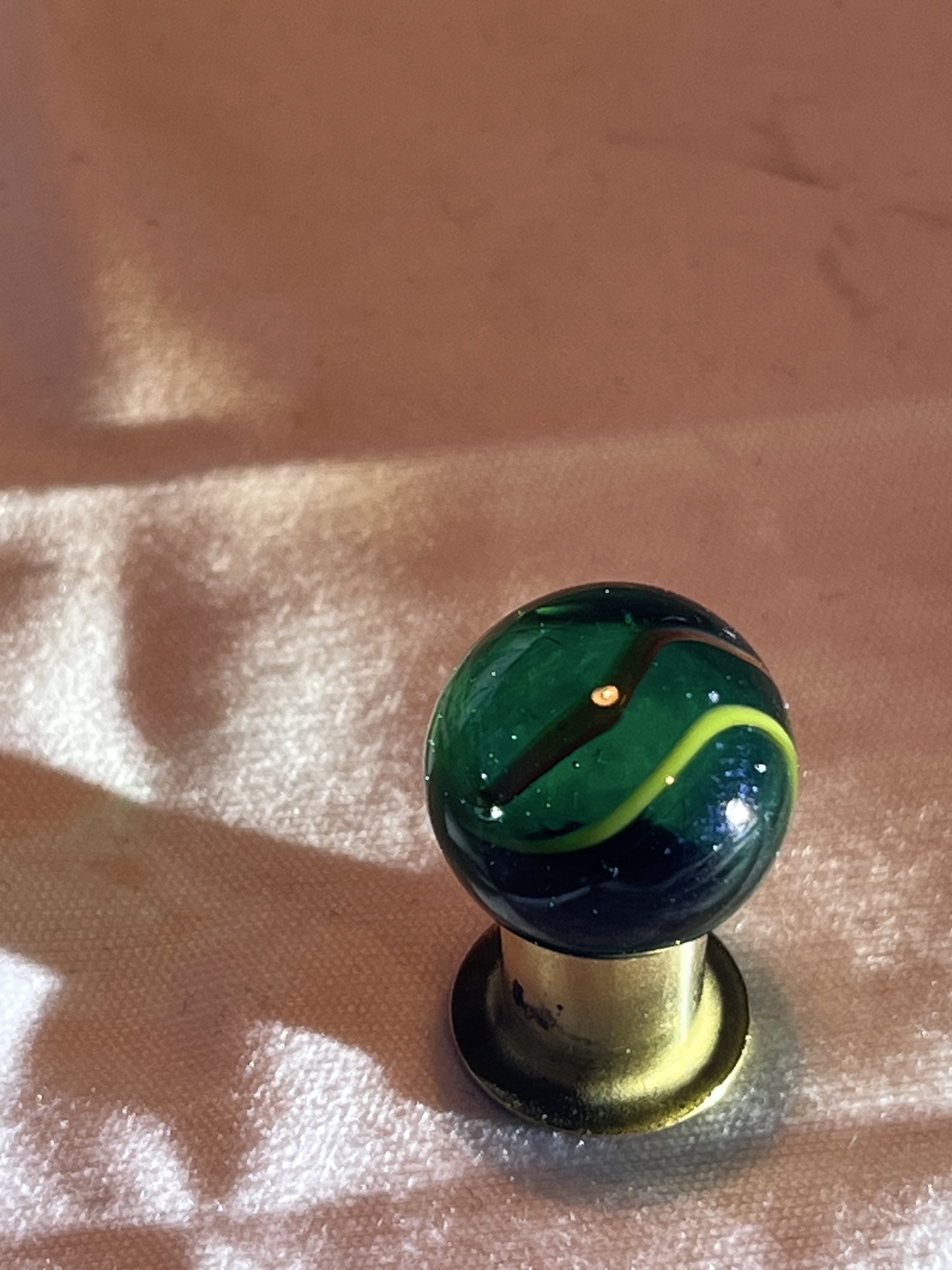 Green Transparent with Yellow Ribbon Swirl by Alley Agate, identification view