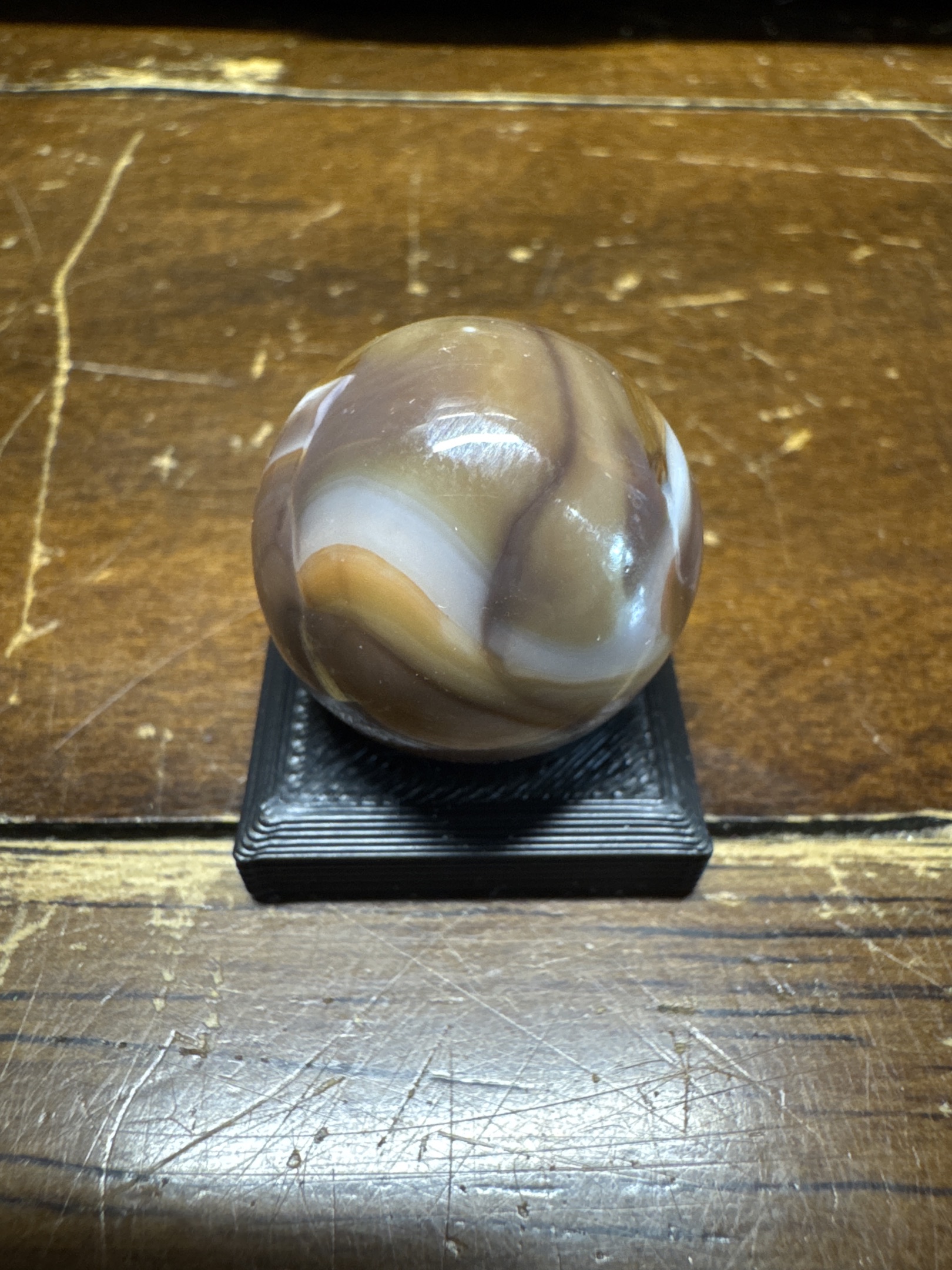 Chocolate Slag Shooter by Akro Agate Company, identification view