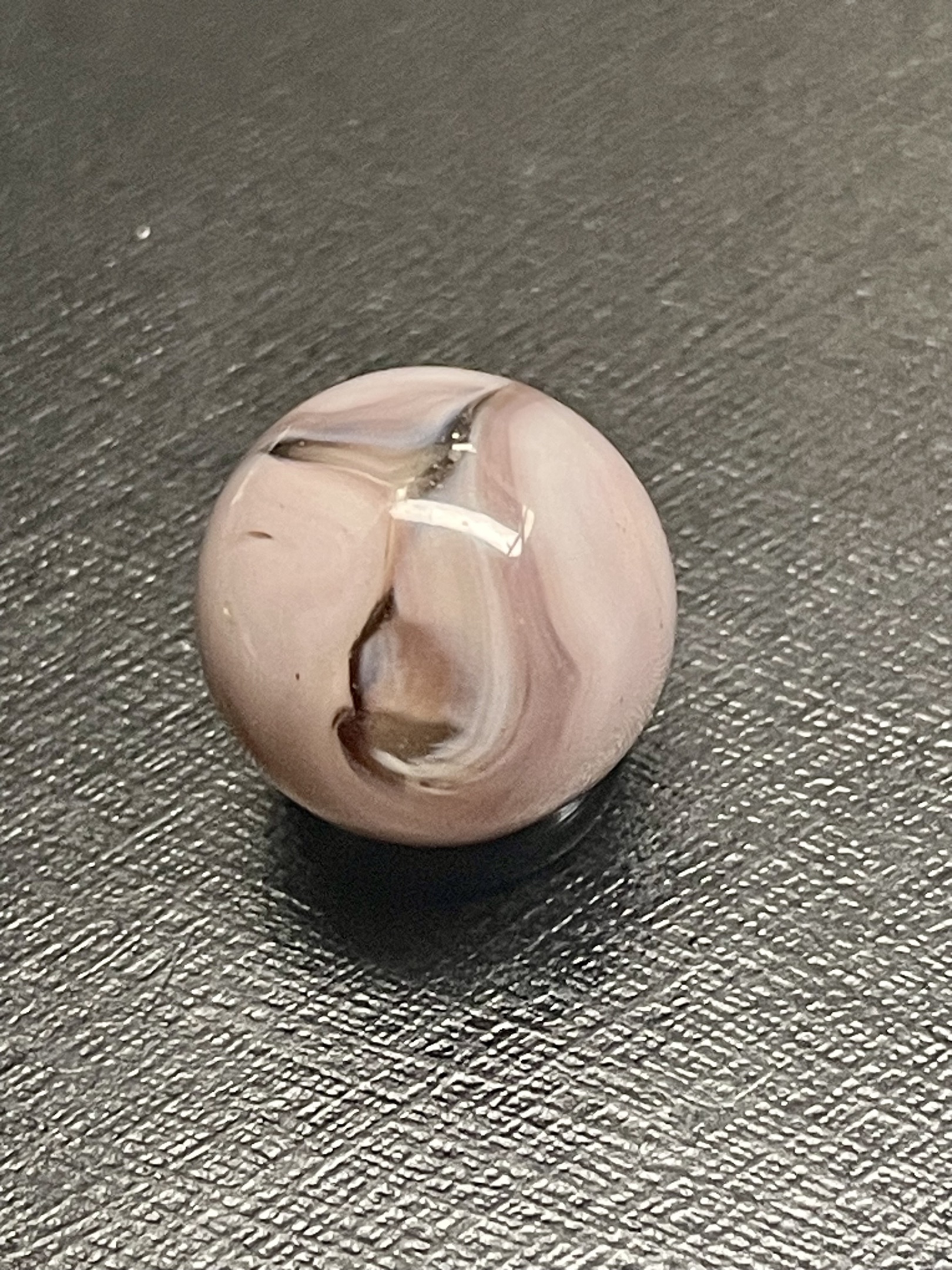 Pink and White Swirl with Oxblood-like Accents by Akro Agate, identification view