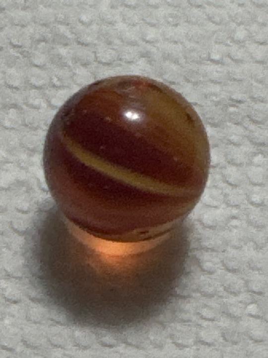 Amber Oxblood Corkscrew by Akro Agate, identification view