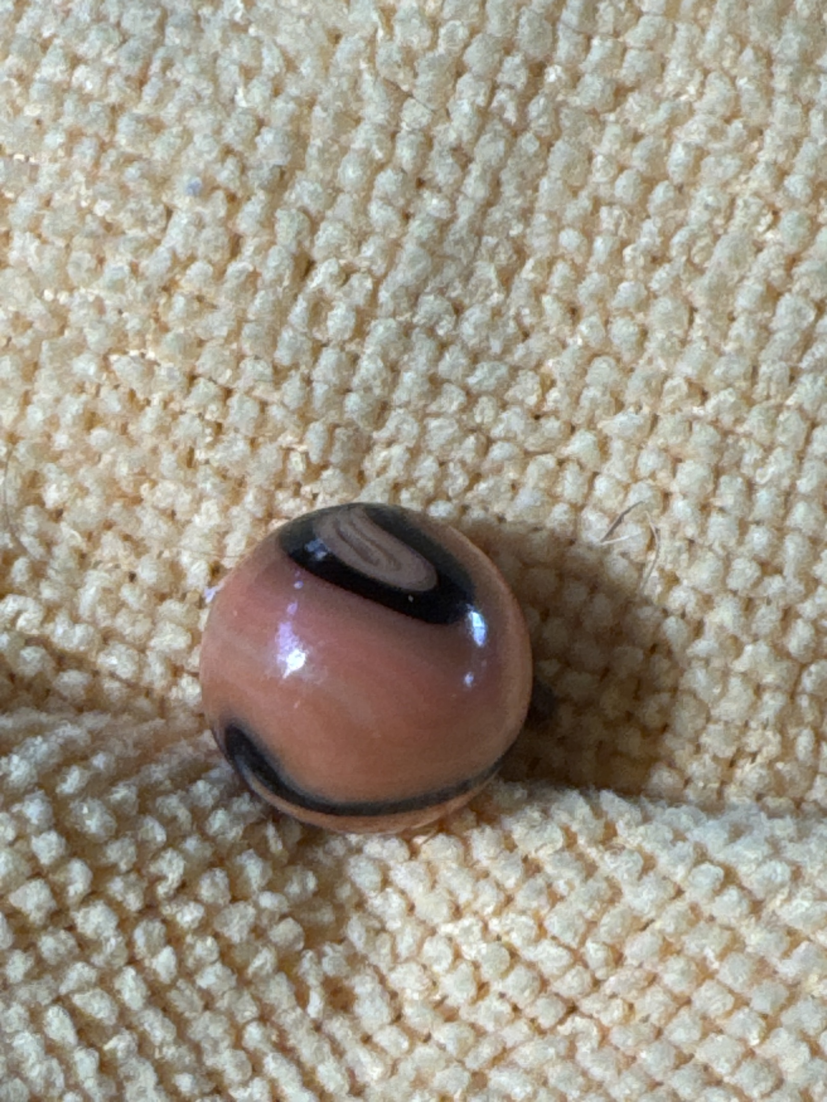 Peach and Black Peewee Corkscrew by Akro Agate